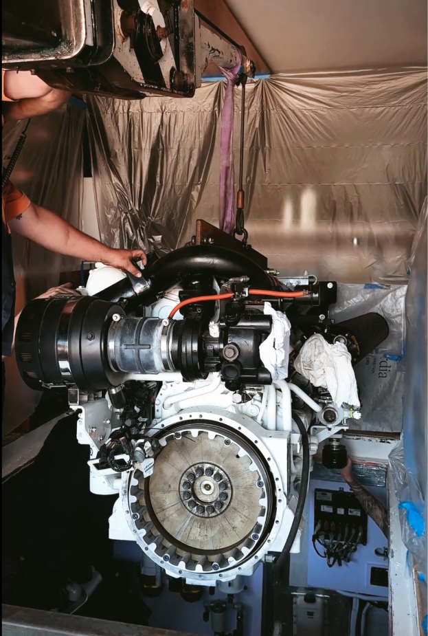 Close-up view of a car engine being installed or serviced