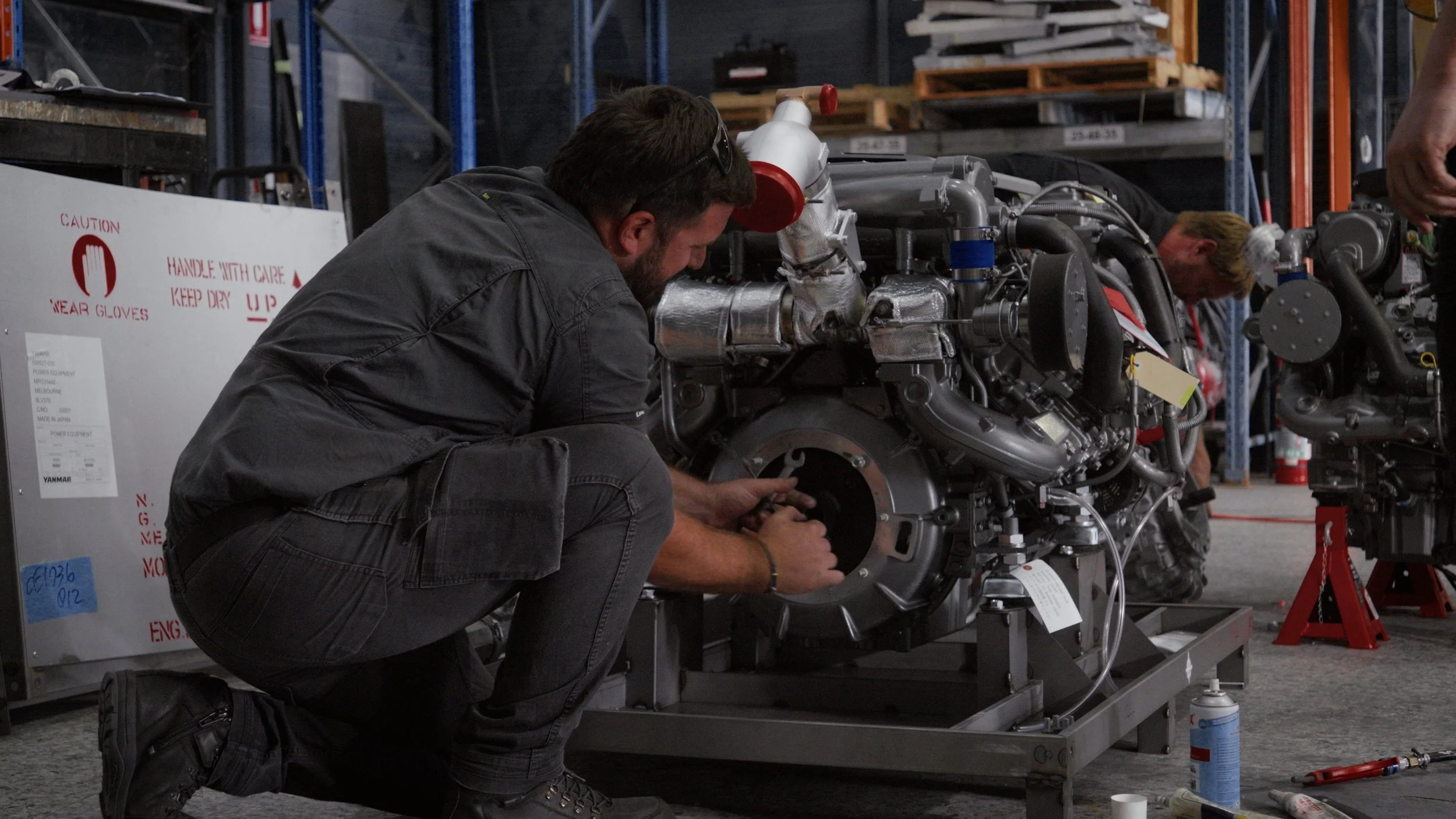 D’Aprix Marine Services team working on a marine engine