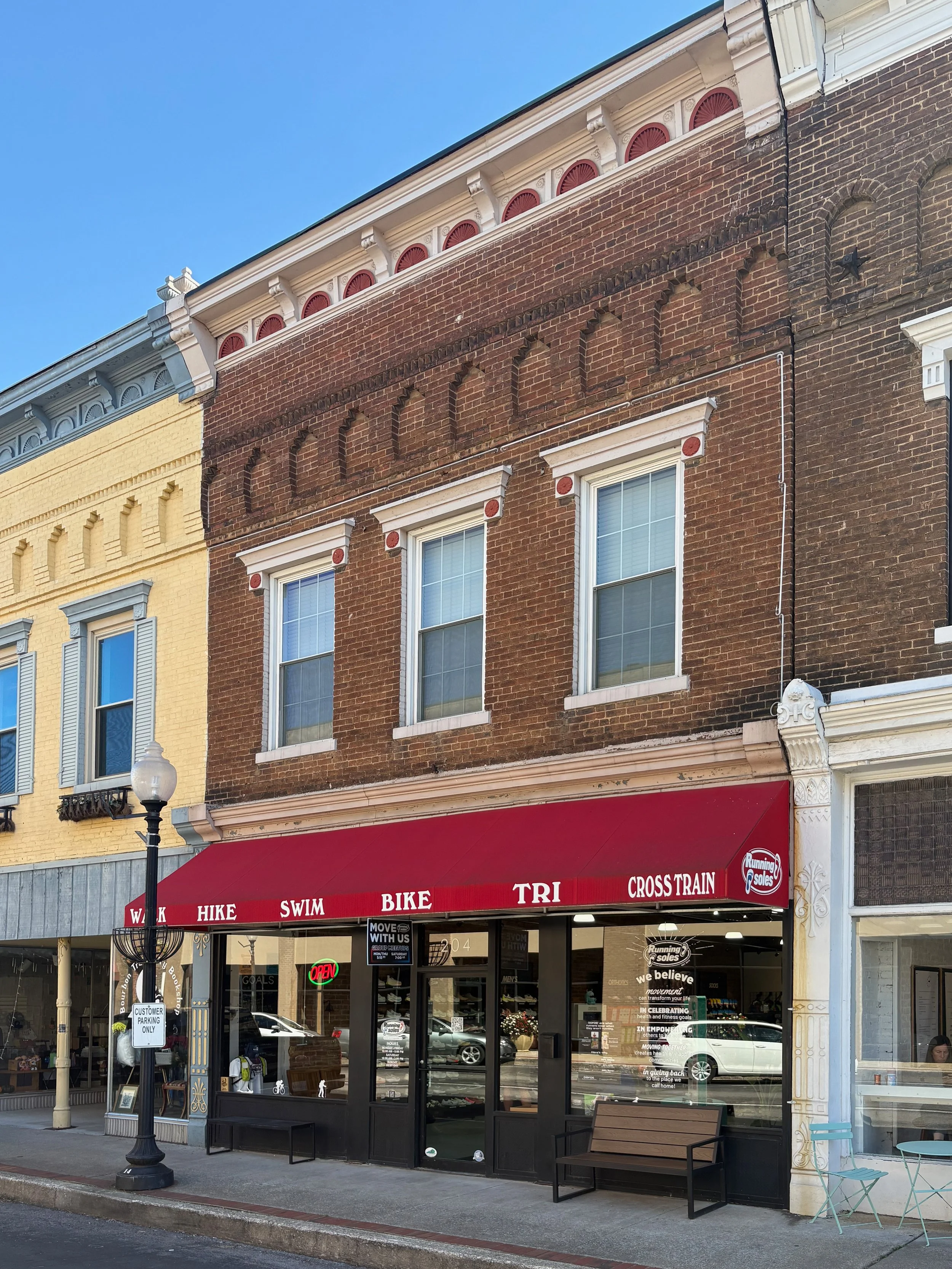 Historic brick storefront for Running Soles in downtown Campbellsville, Kentucky