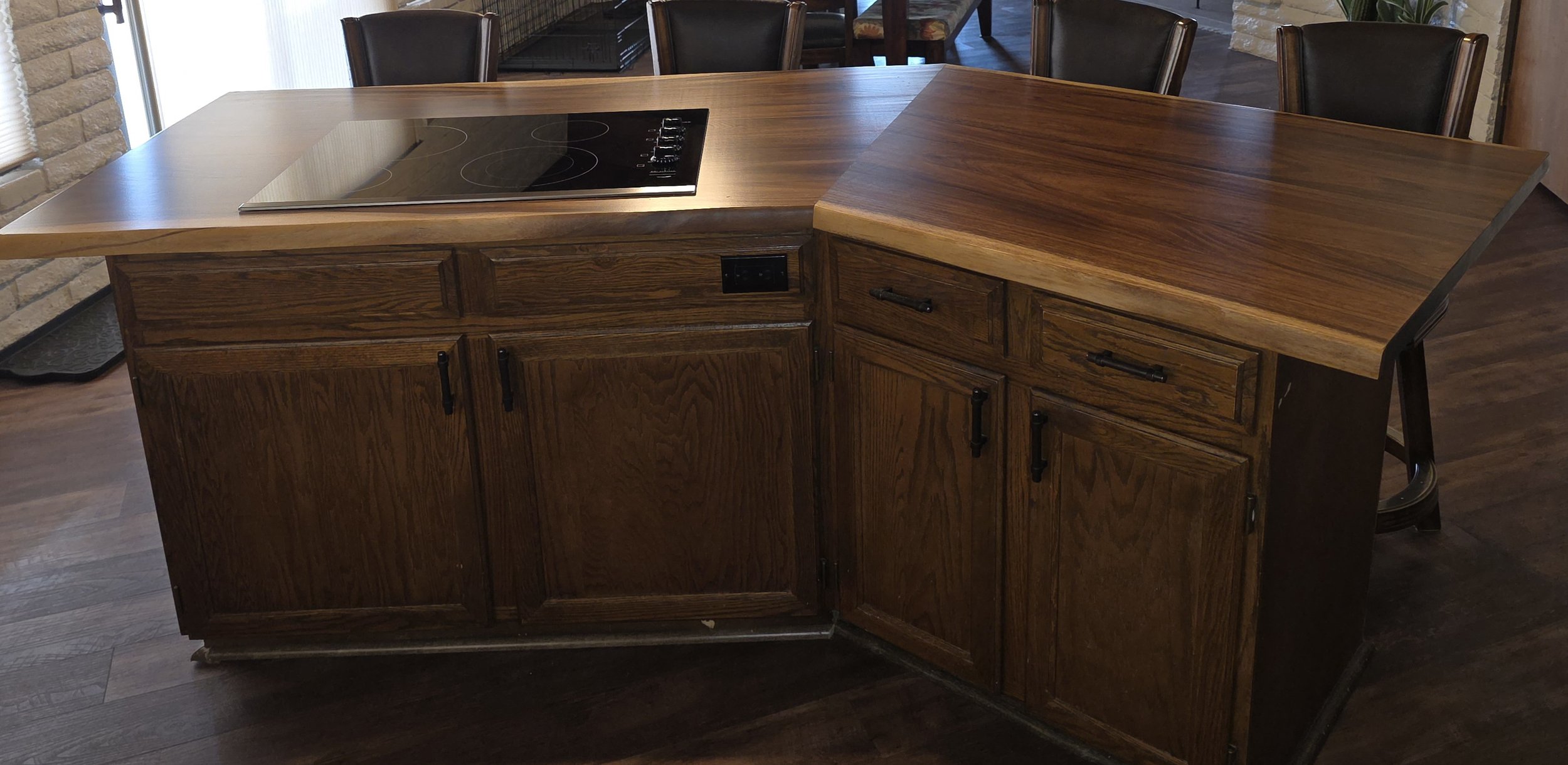 Kitchen cabinetry:
Custom wood kitchen cabinets and countertop with electric stove top instulation.