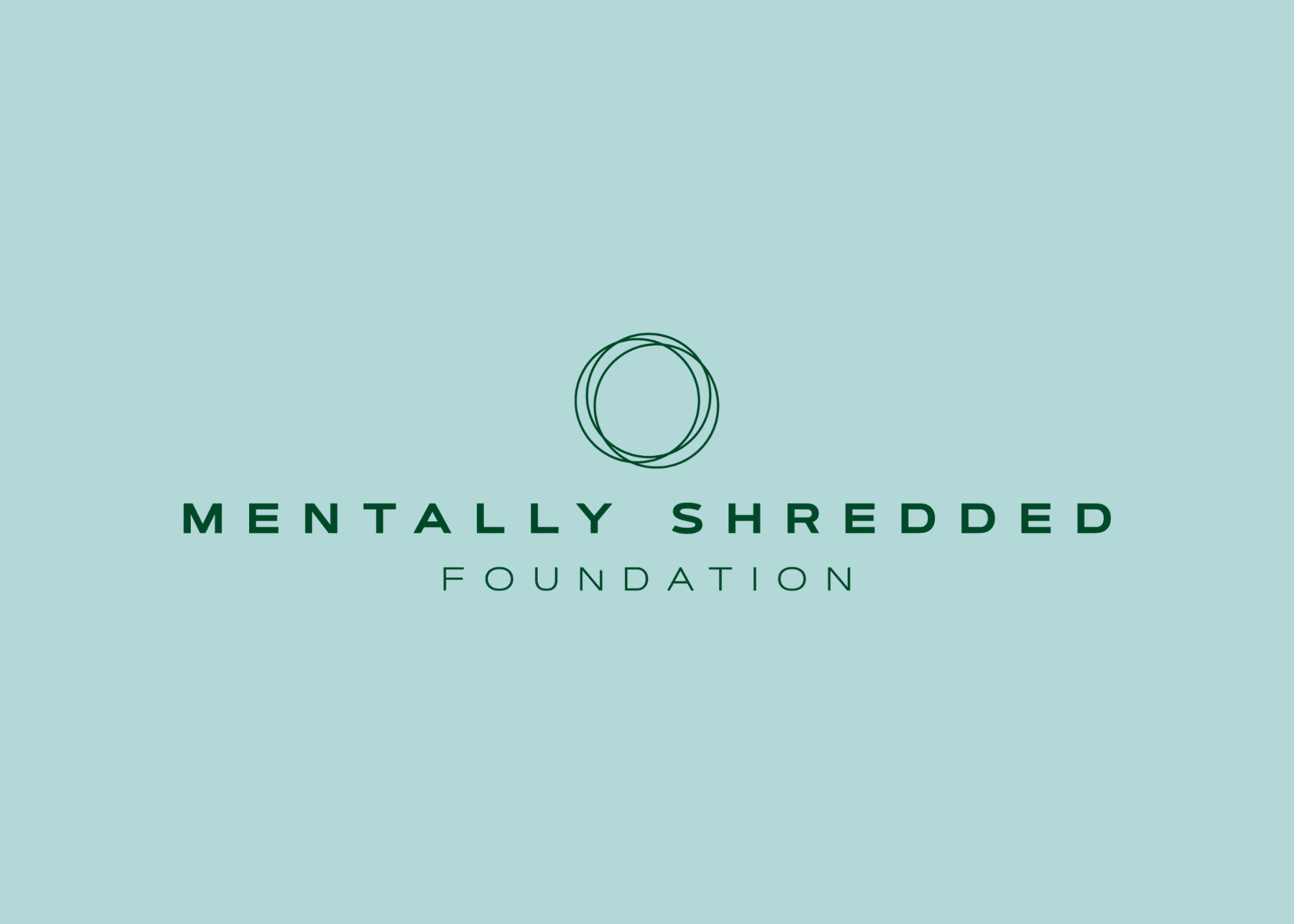Logo for the Mental Health Shredder Foundation with three overlapping circles above the foundation name on a light teal background.