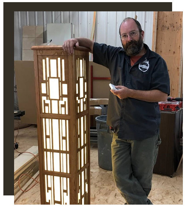 Anthony Piazza owner of bainbridge island woodworks with custom wood light