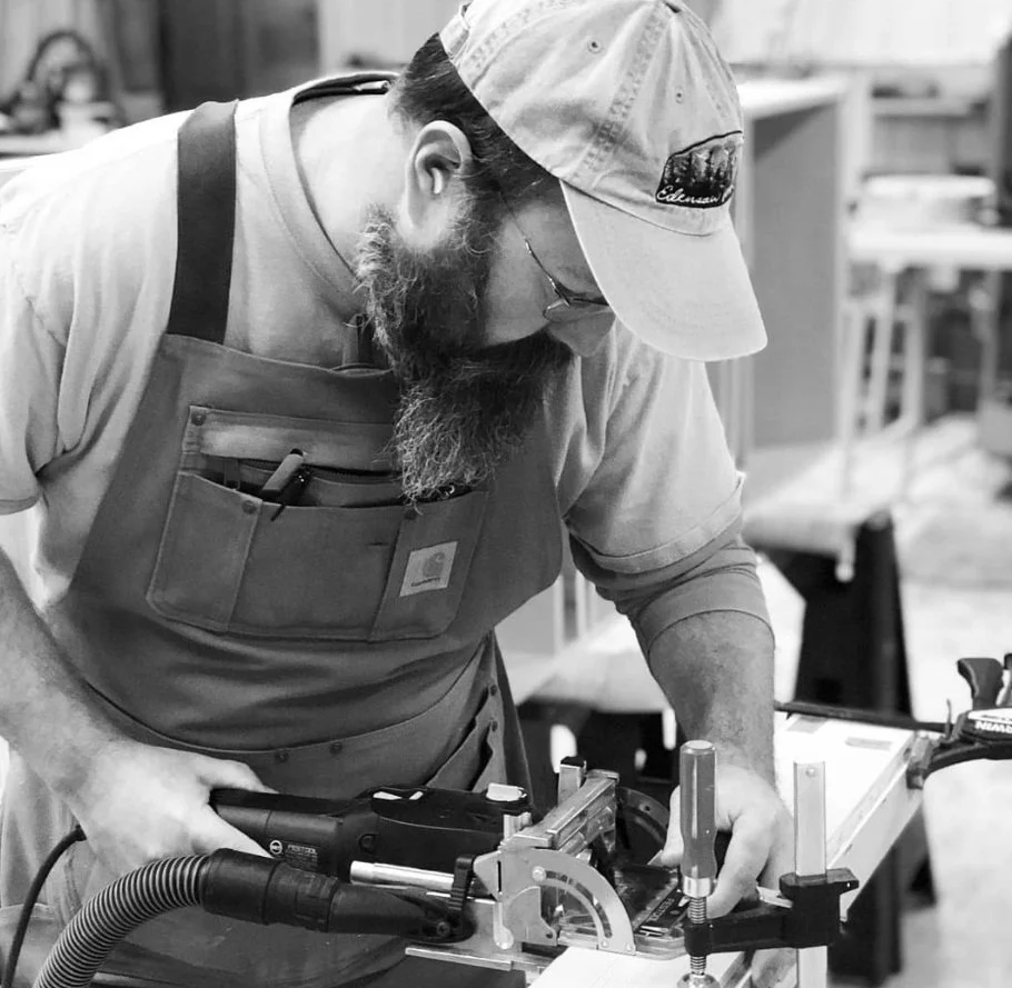 Owner Anthony Piazza working on custom cabinet