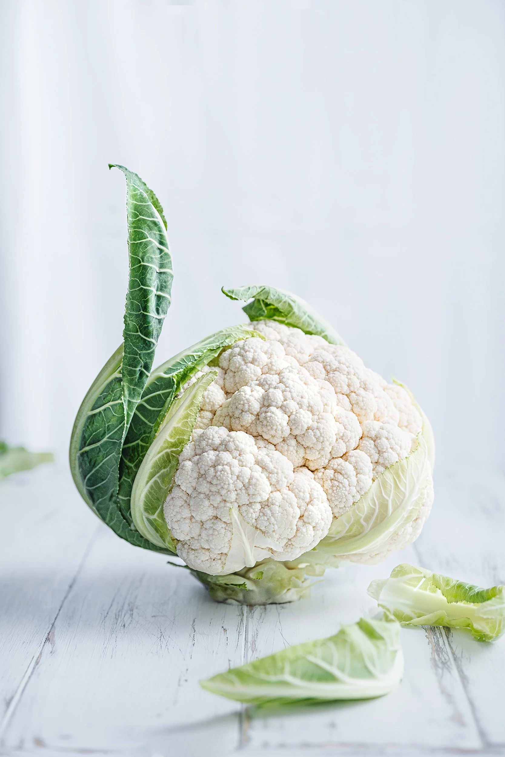 Professional food photography and styling of fresh cauliflower, created for food brands, agricultural products, packaging and commercial advertising