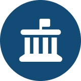 Icon of a government building with columns and a flag on top, inside a circular blue background.