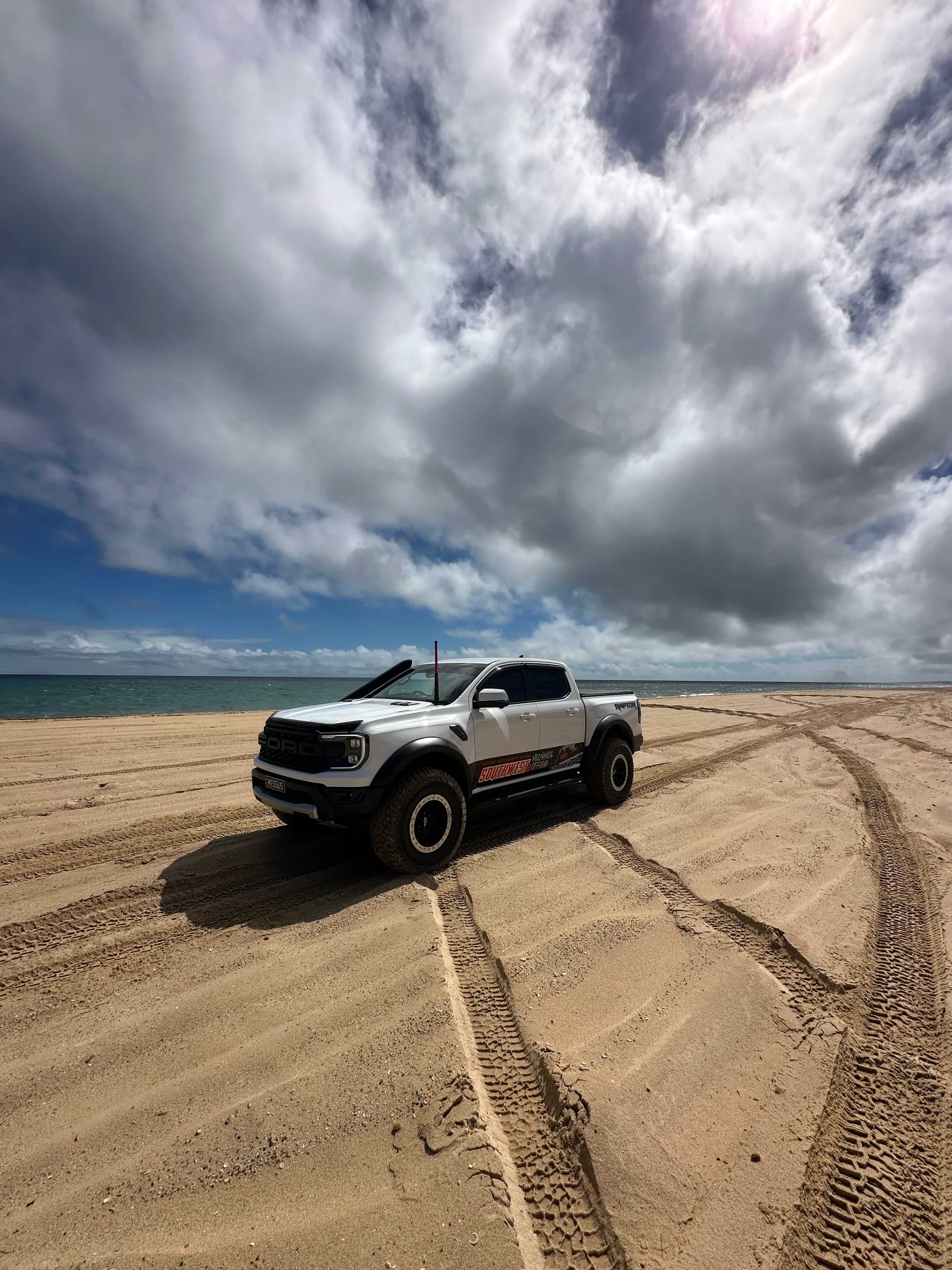 4wd going offroad on a beach in bunbury