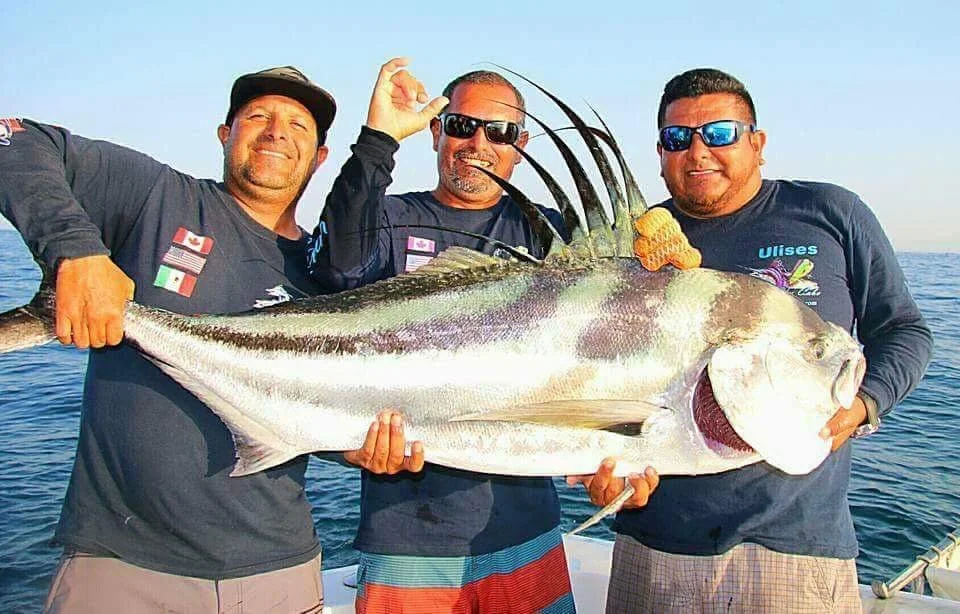 Three anglers displaying fish caught with Hellraiser Teaser lure