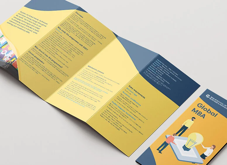 Brochure for Global MBA program with a colorful illustration of people around a large lightbulb.