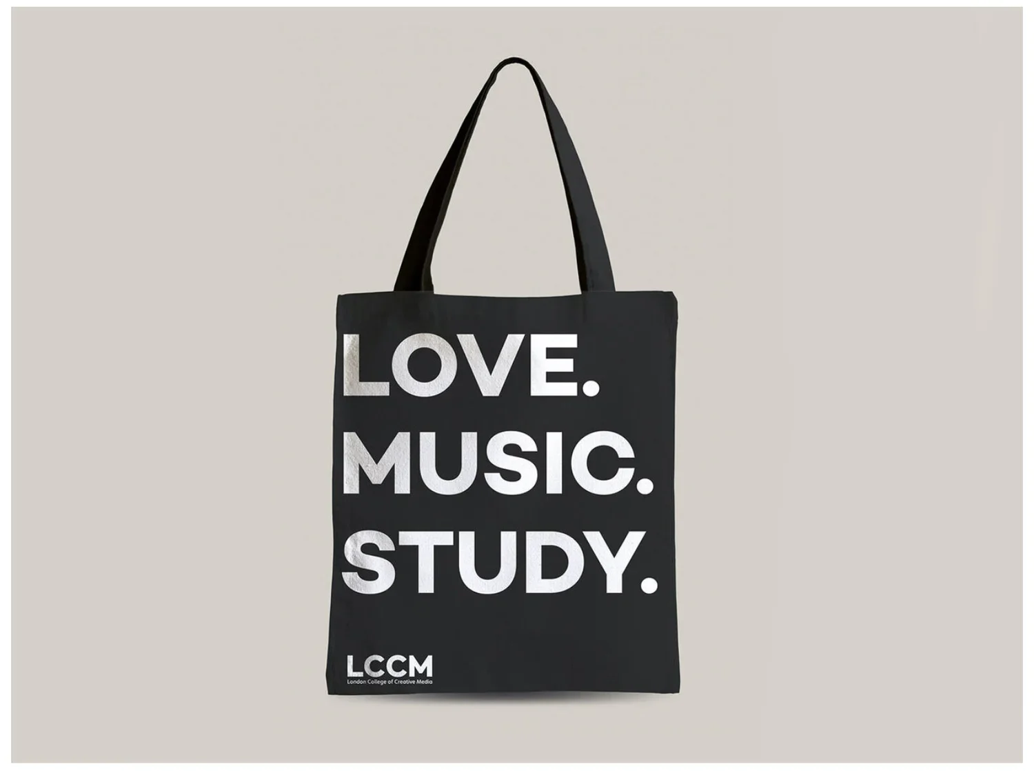 Black tote bag with bold white text reading 'LOVE. MUSIC. STUDY.', and smaller text at the bottom that says 'LCCM London College of Creative Media'.