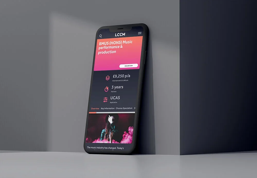 Smartphone placed on a white surface showing a music industry application with pink and black interface, displaying course details, price, duration, and application type, with a promotional image of a woman with pink smoke.