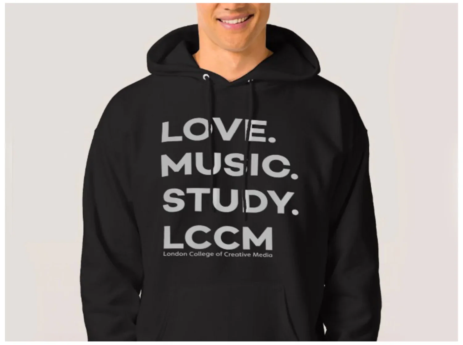 A person wearing a black hoodie with text that reads "LOVE. MUSIC. STUDY. LCCM" and "London College of Creative Media" underneath.