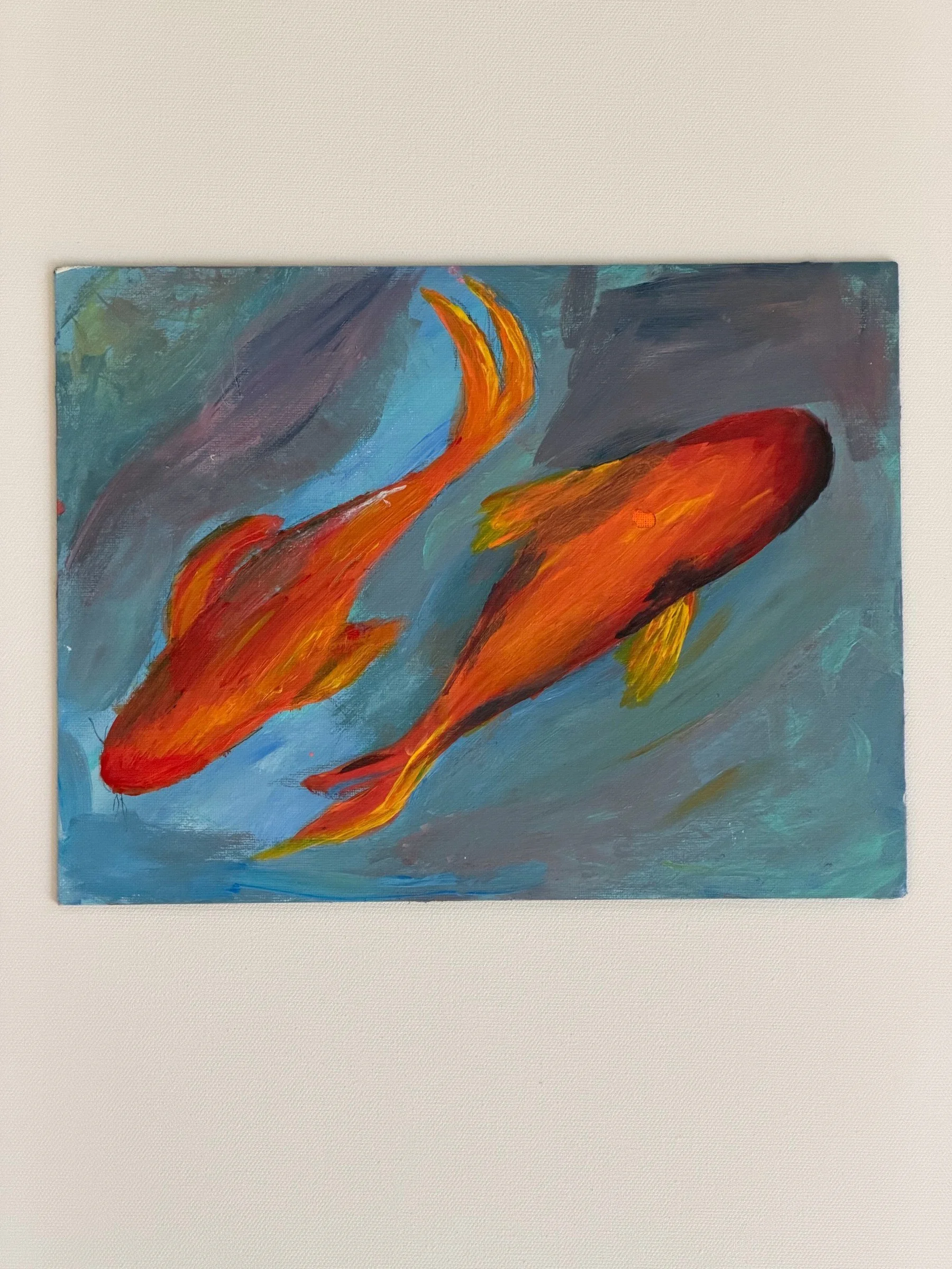 YIN YANG IN PUBLIC. Acrylic on canvas. 9×12". Two koi, orange and red, swim across a blue-grey ground, seen from above. The pair echoes the earlier yin-yang composition, here opened out and released from the circle.