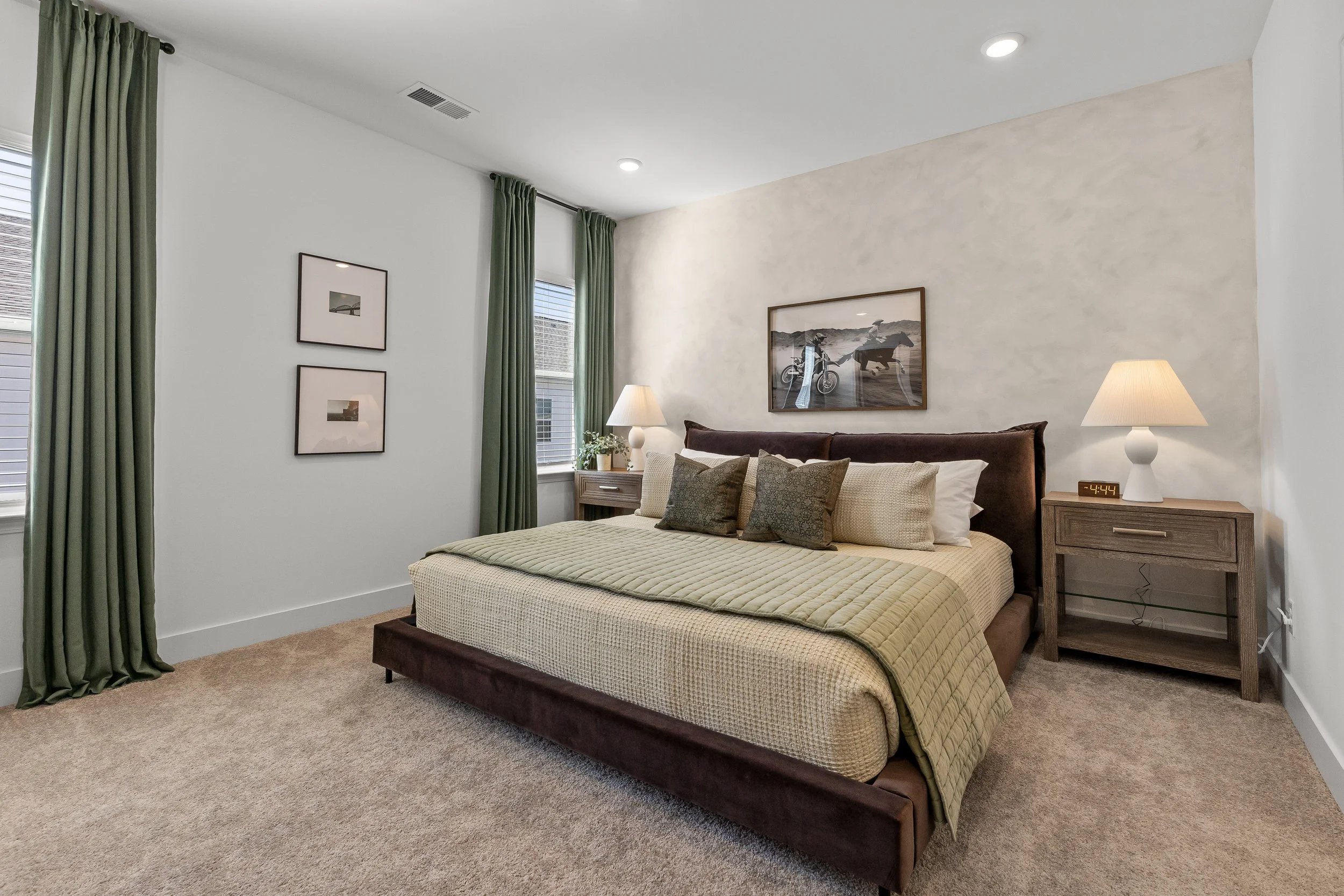 Serene king bedroom with premium bedding and a warm, upscale design at Summit & Stone in Chattanooga.