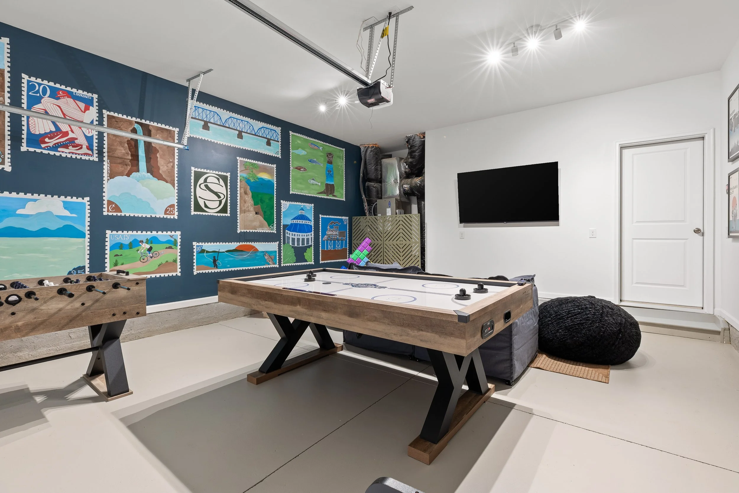 Game room at Summit & Stone Chattanooga vacation rental with air hockey and foosball.
