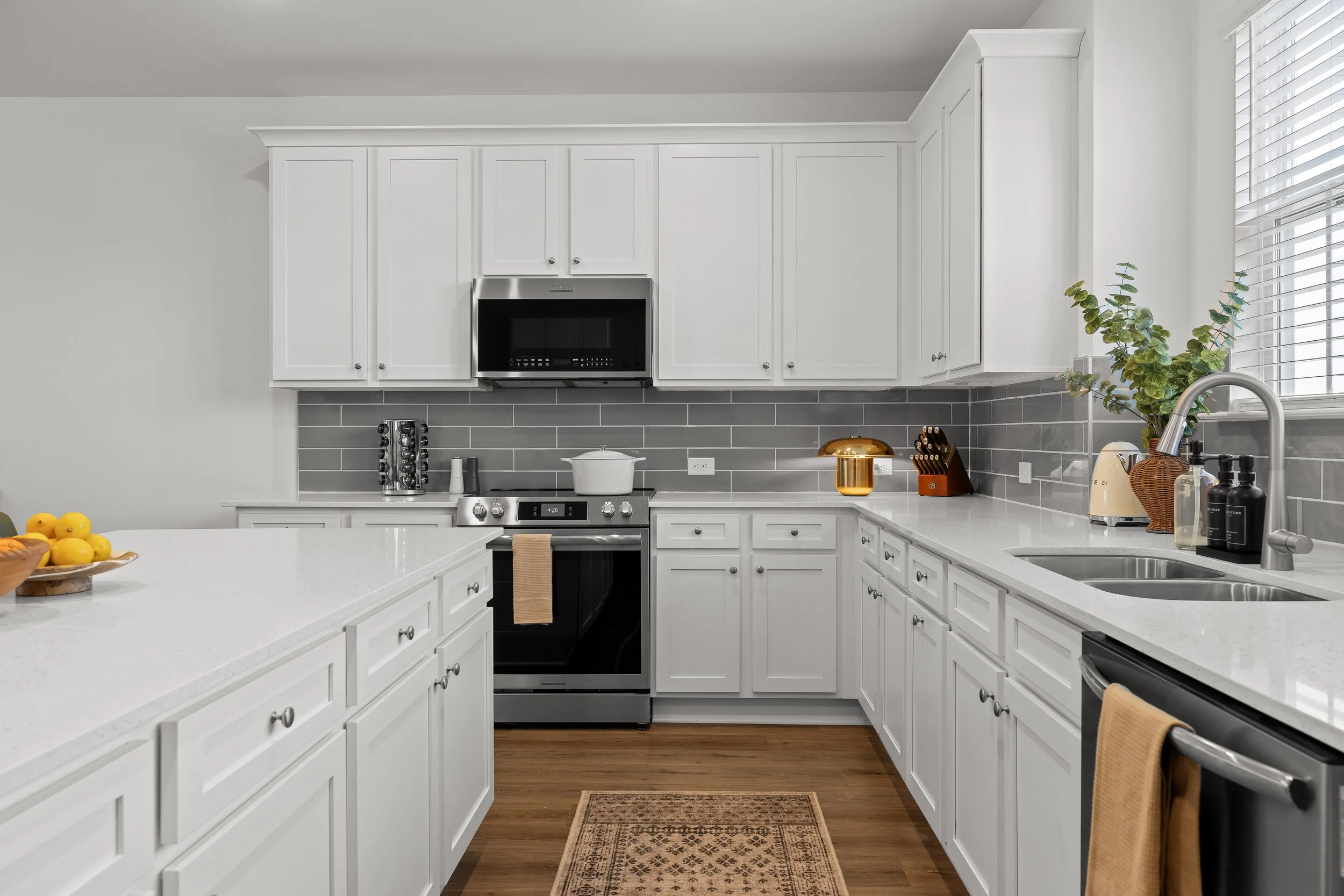 Bright, fully equipped kitchen with modern appliances and plenty of space for groups at Summit & Stone in Chattanooga.