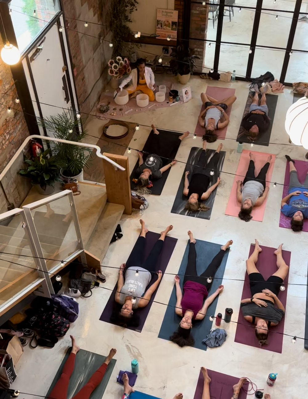 group-laying-down-on-yoga-mats.webp