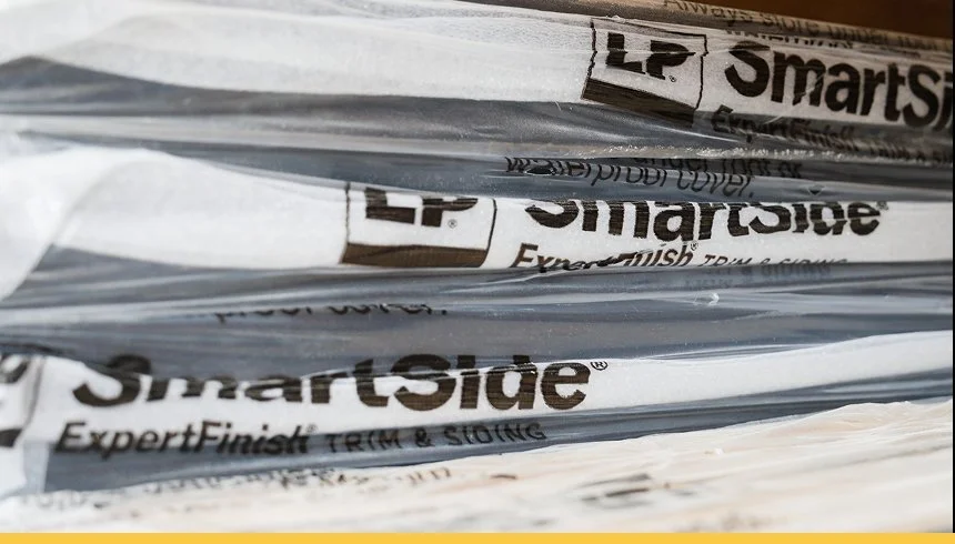 Close-up of stacked newspapers with the SmartSide logo visible on the sides.