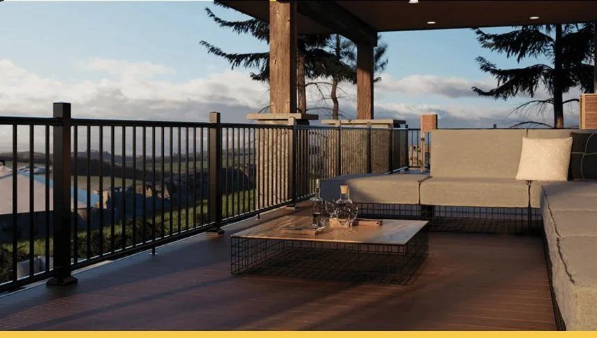A cozy outdoor balcony with a wooden floor, a beige sofa with cushions, a coffee table with drinks, overlooking a scenic landscape with trees and blue sky.