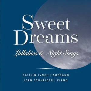 Cover of a music album titled 'Sweet Dreams: Lullabies & Night Songs,' featuring a blue background with a moon and clouds, and credited to Caitlin Lynch (soprano) and Jean Schneider (piano).