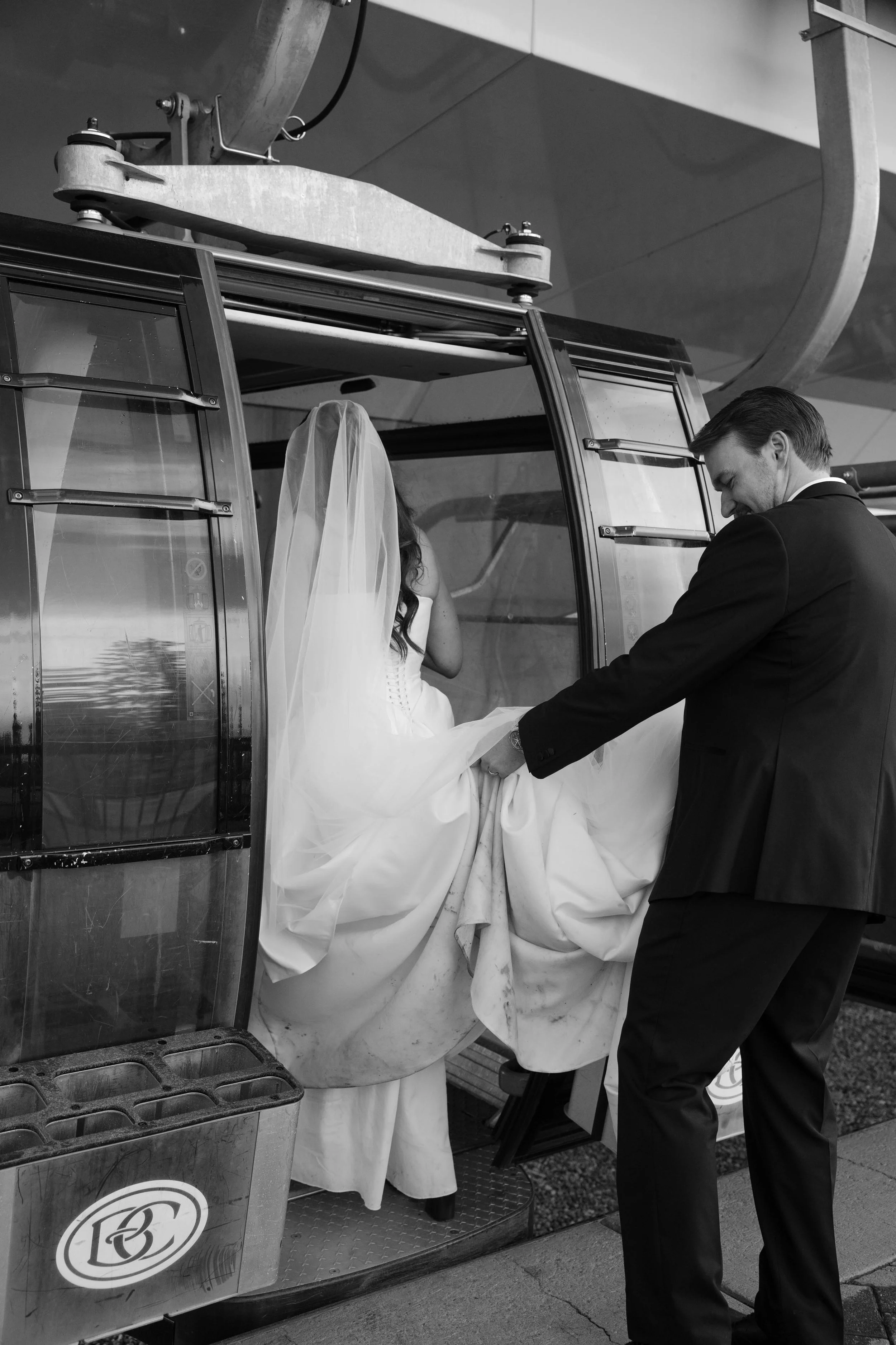 a newlywed bride and groom getting into a gondola in telluride colorado