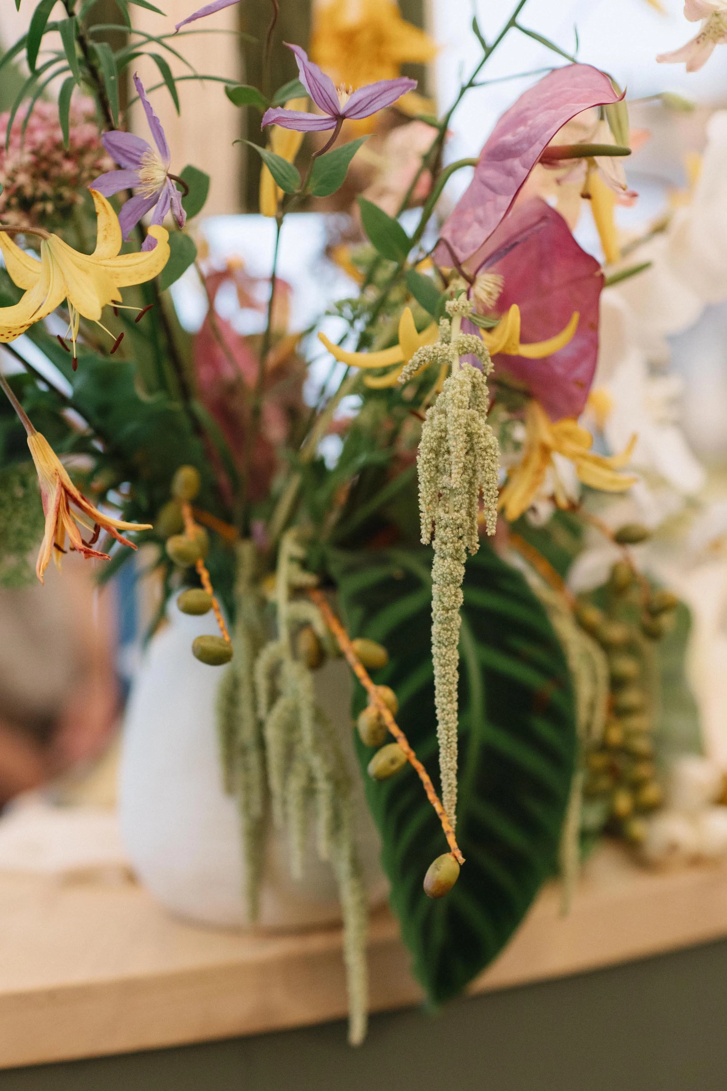 a gorgeous floral bouquet on tables at a wedding
