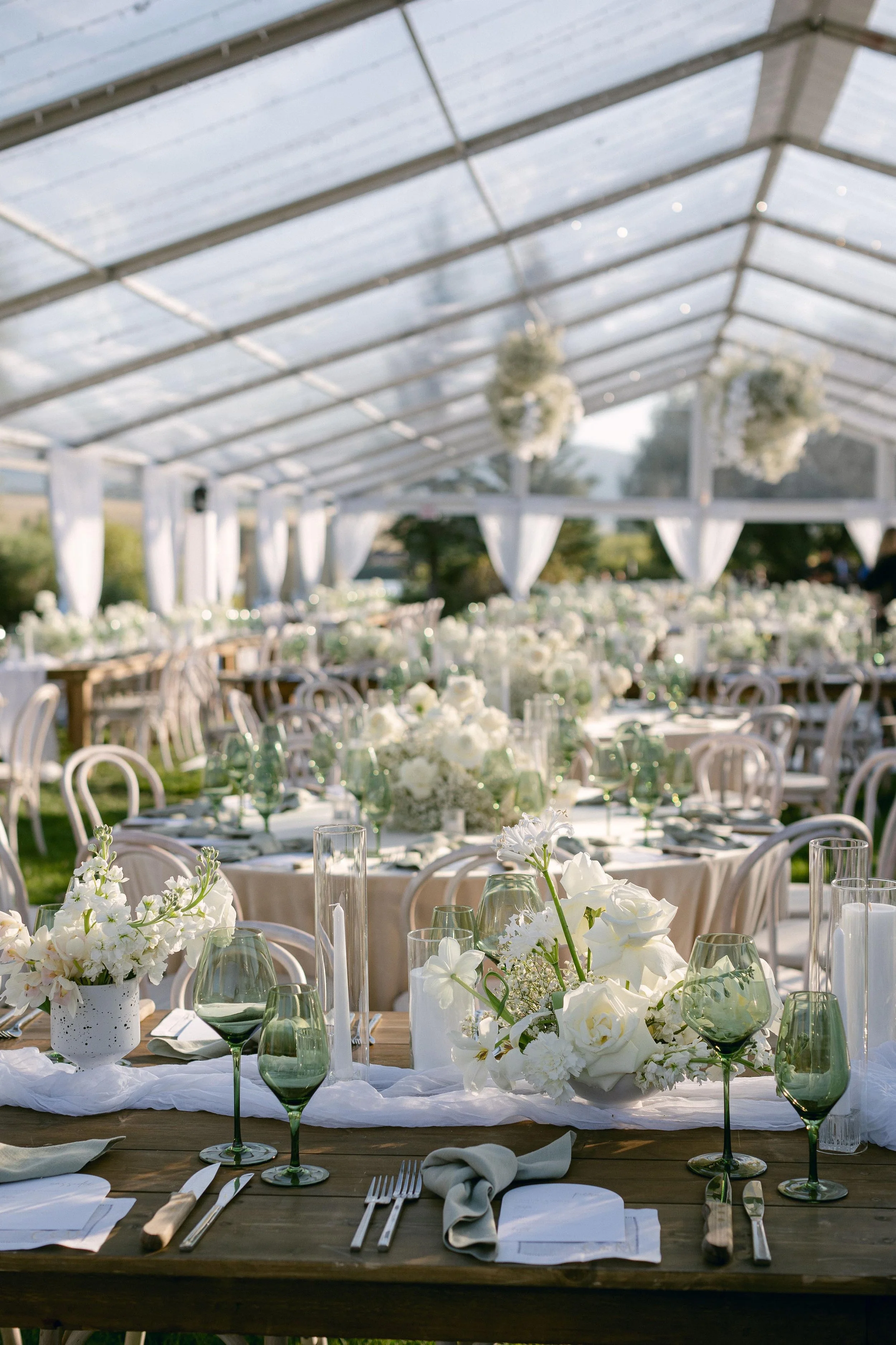 carefully selected white and green table decor for a wedding in colorado