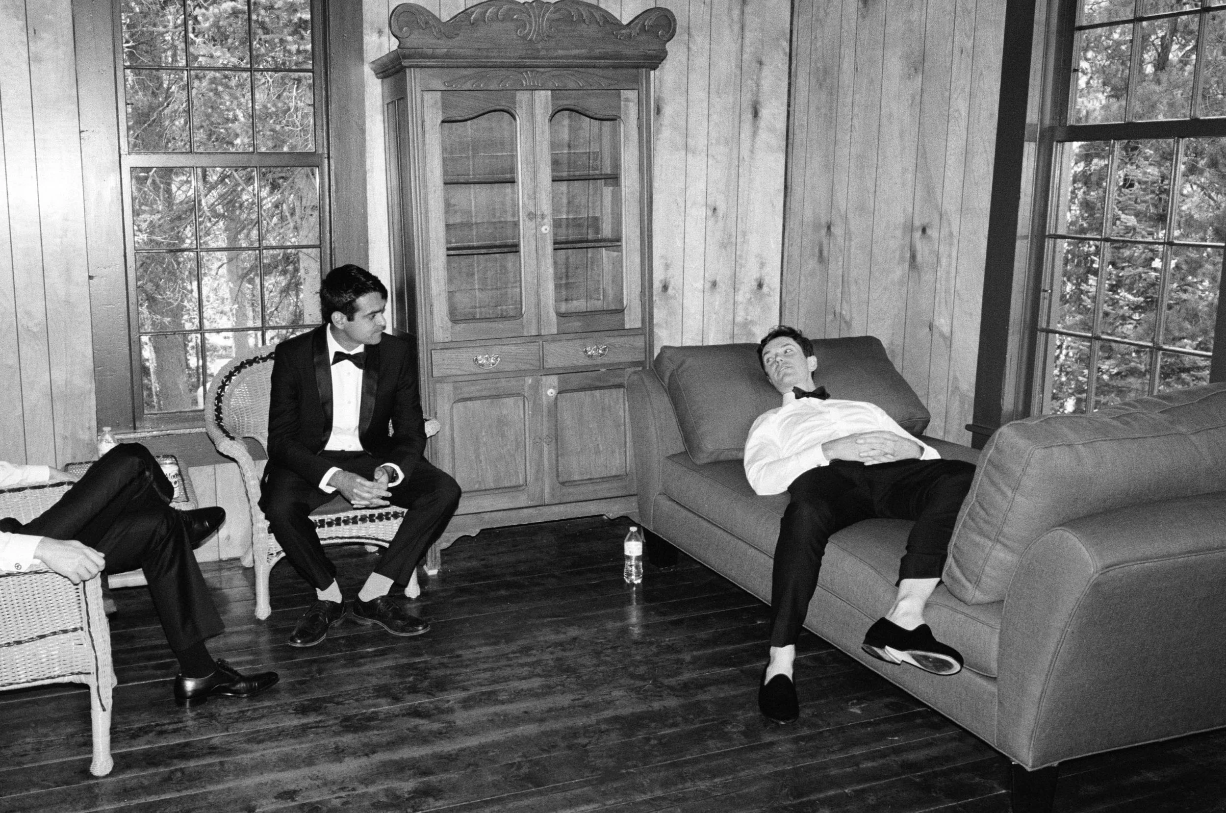 a groom and friends relaxing and chatting before the wedding