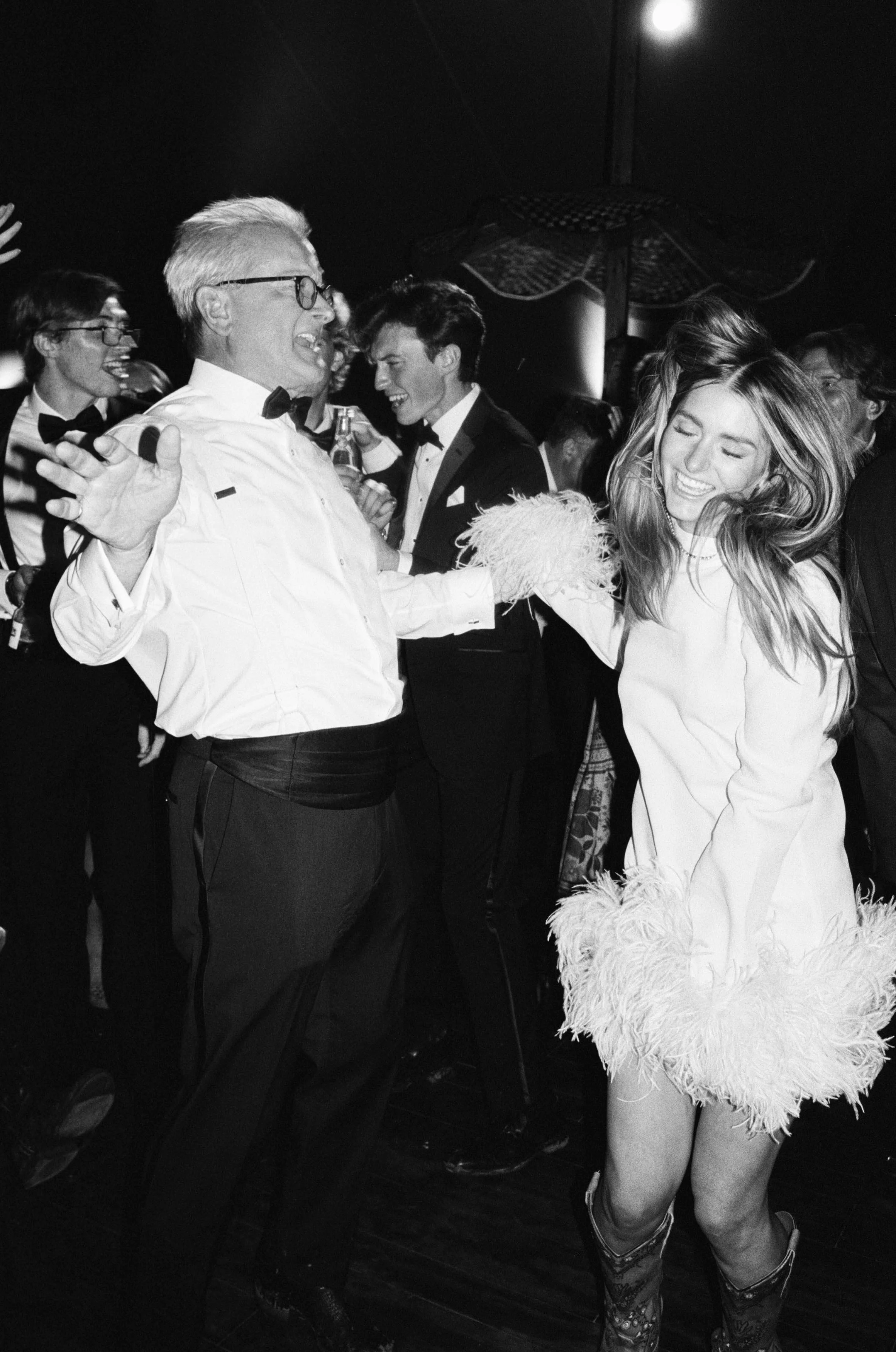 newlywed bride dancing with her father after the wedding ceremony in colorado