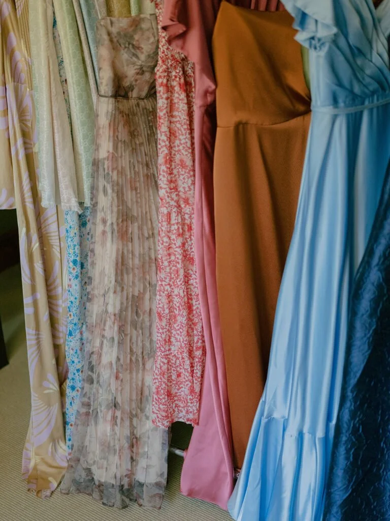 Eclectic mix of bridesmaid dresses showcasing playful and unexpected wedding colors for a fall wedding.