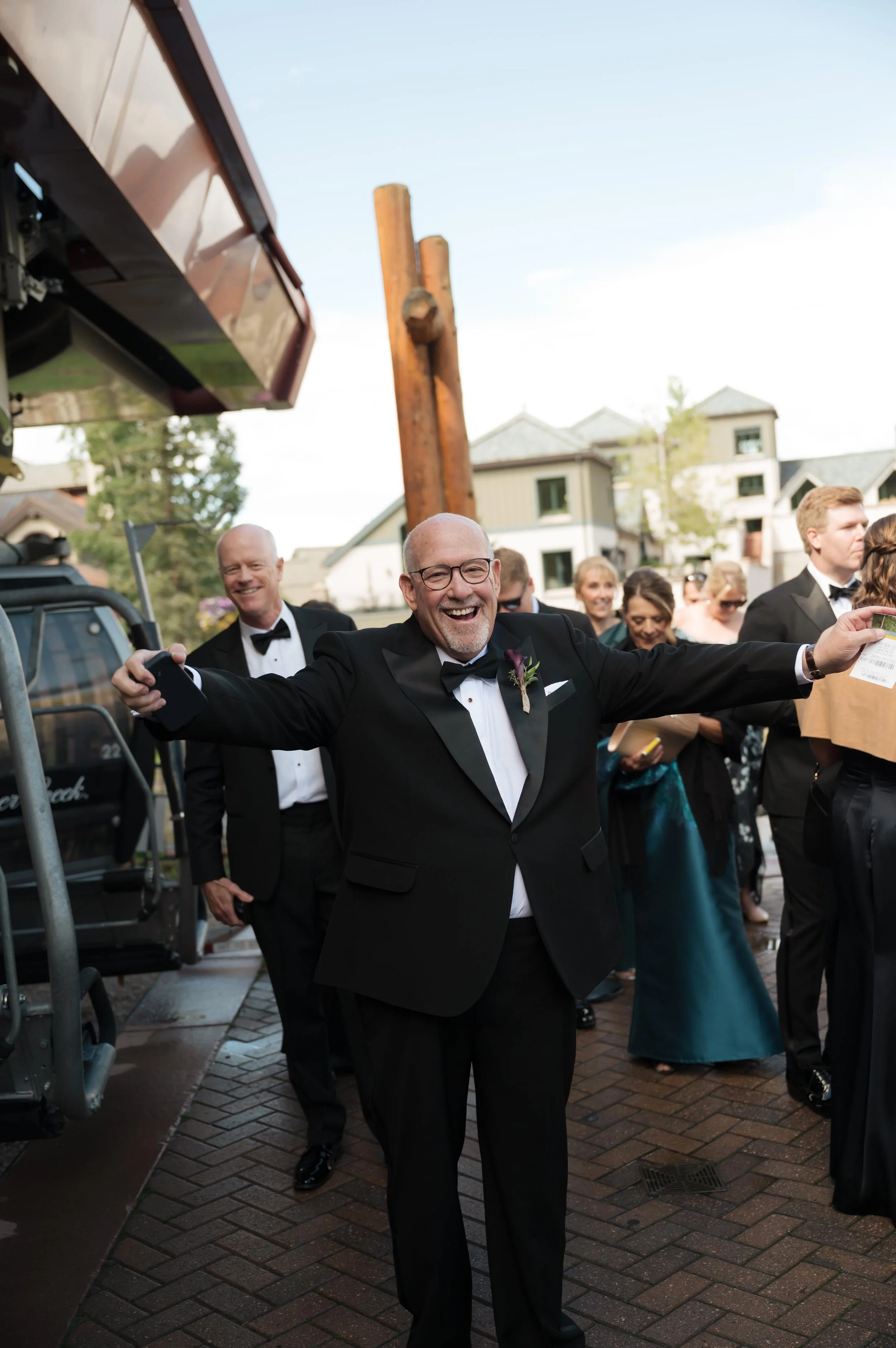 a father of the groom walking towards his son on his sons wedding day