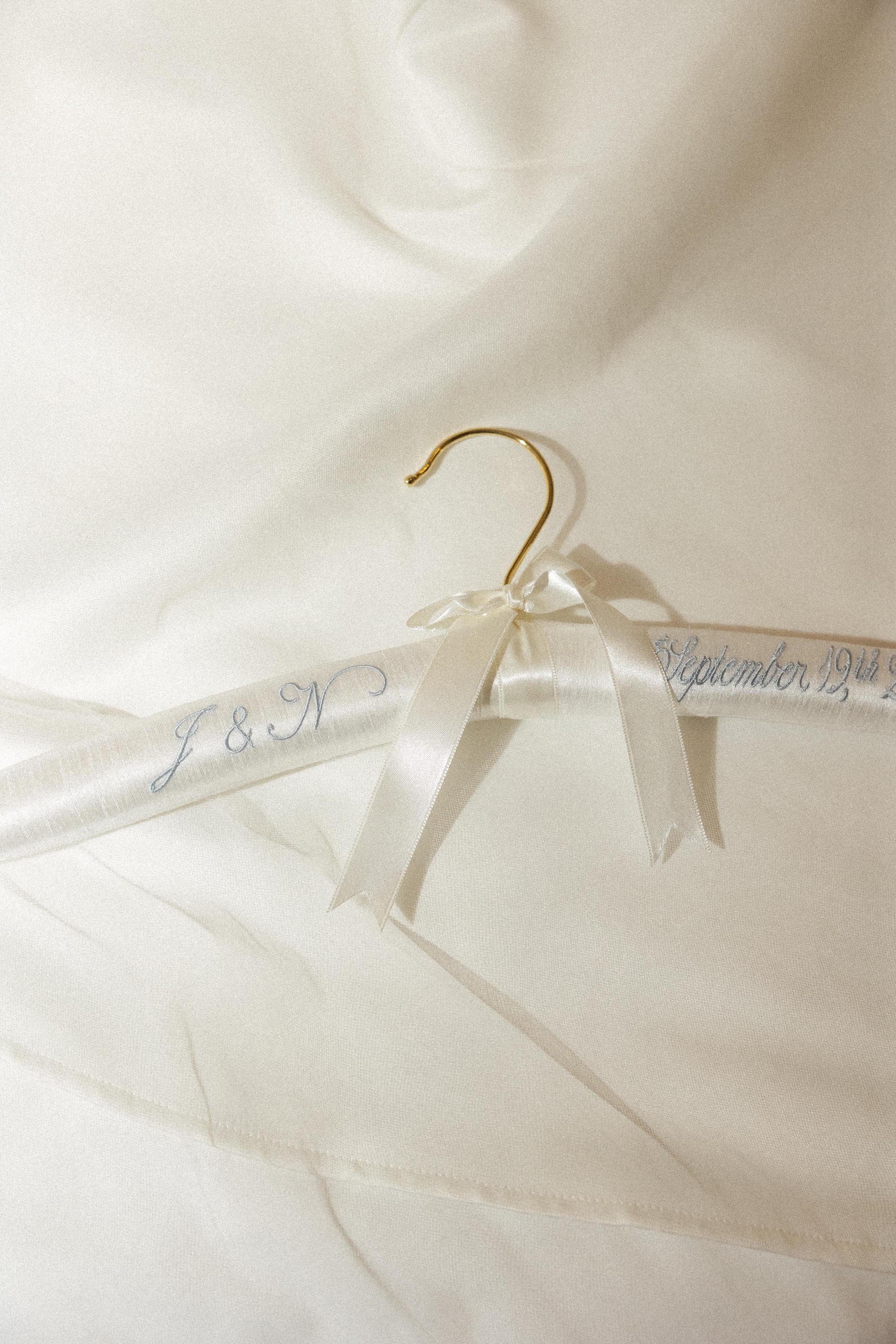 a custom embroidered hanger for a bride's wedding dress in beaver creek colorado