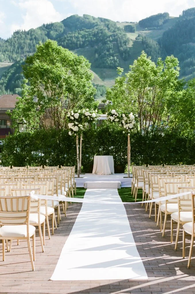 ceremony with mountain views in the background - Mountain Wedding Venues in Colorado