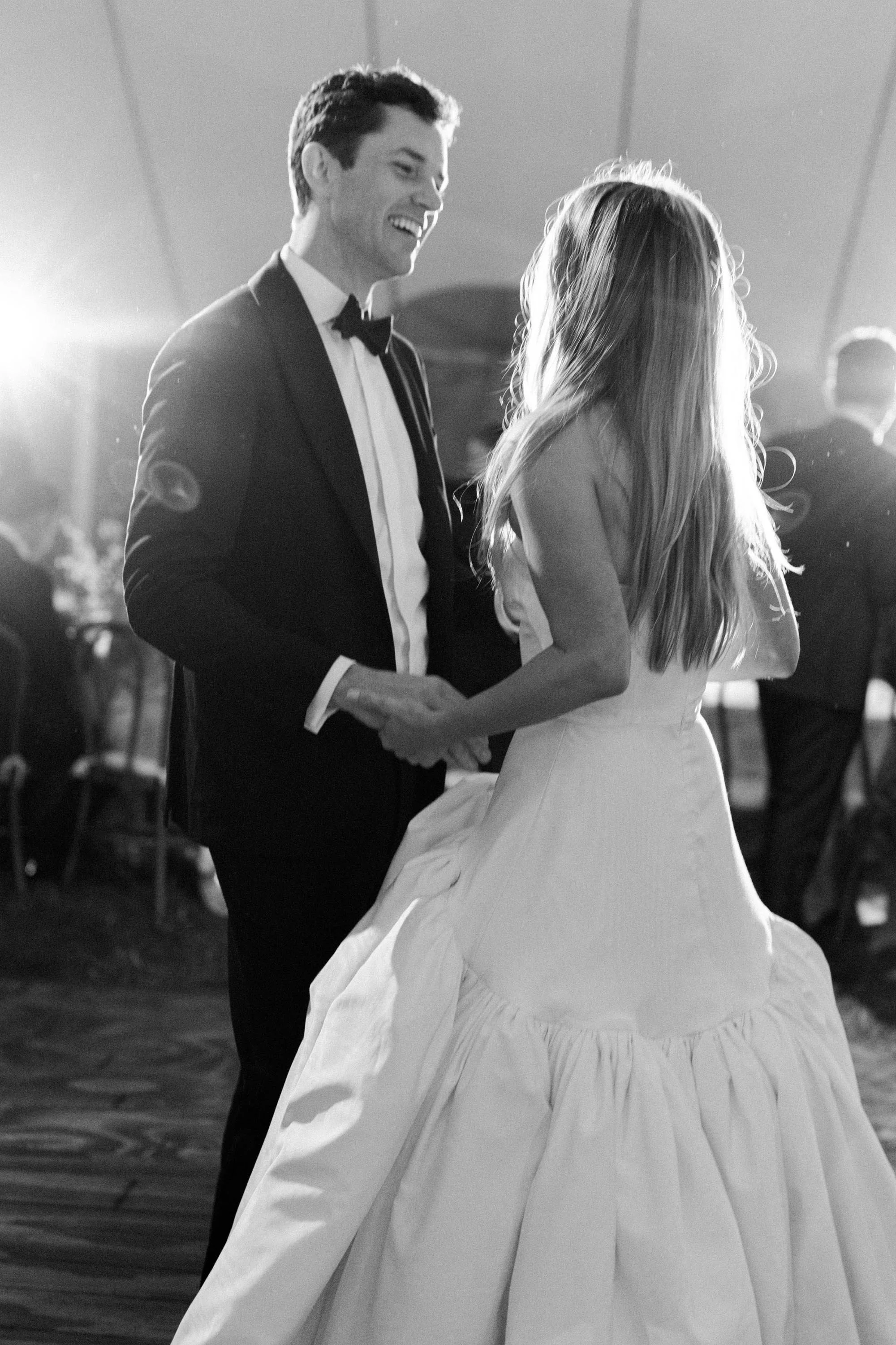 bride and groom smiling at each other in vail colorado