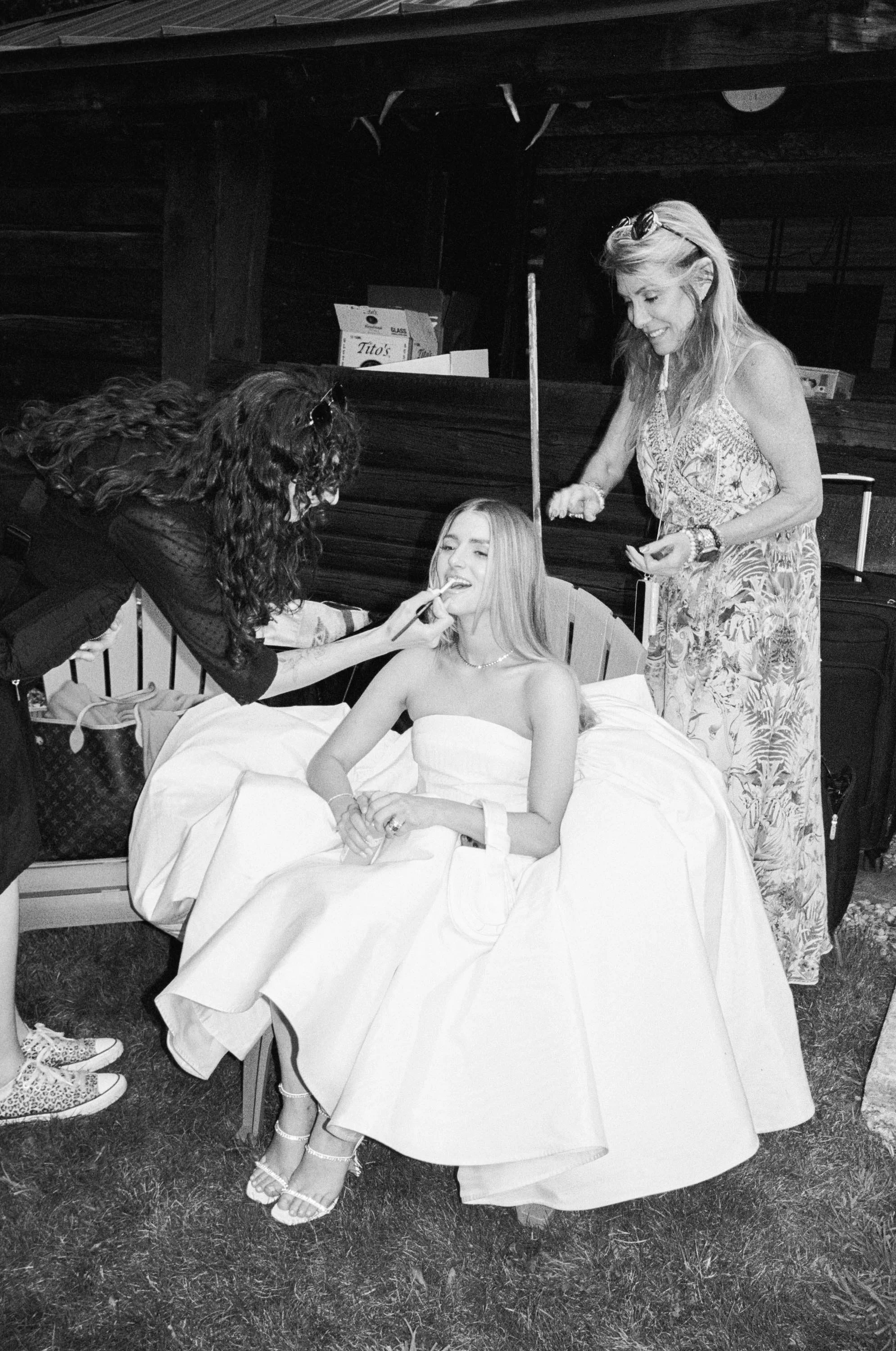 a bride getting her makeup done before her wedding in colorado