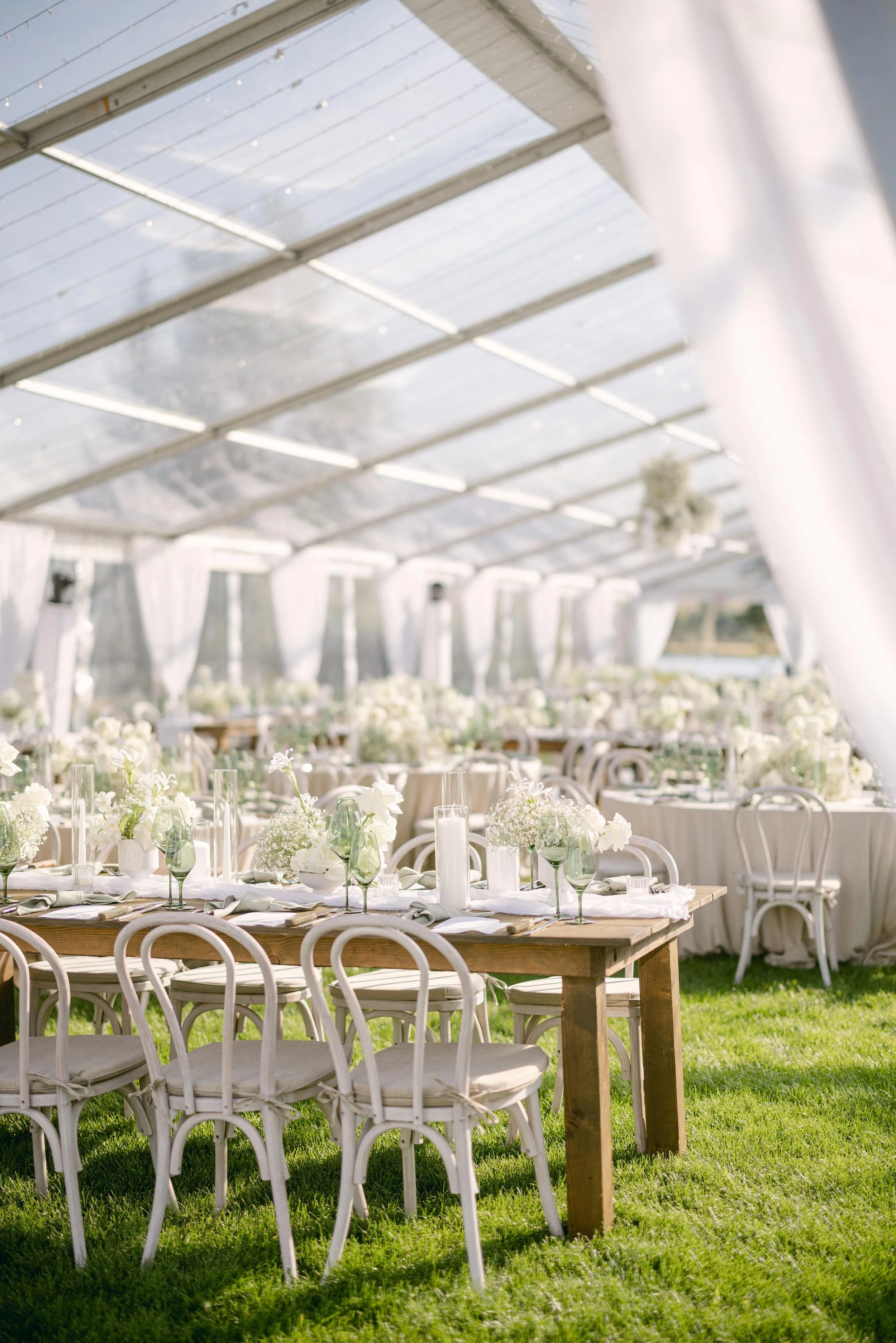 white table and chair wedding decor under a tent outside in aspen colorado