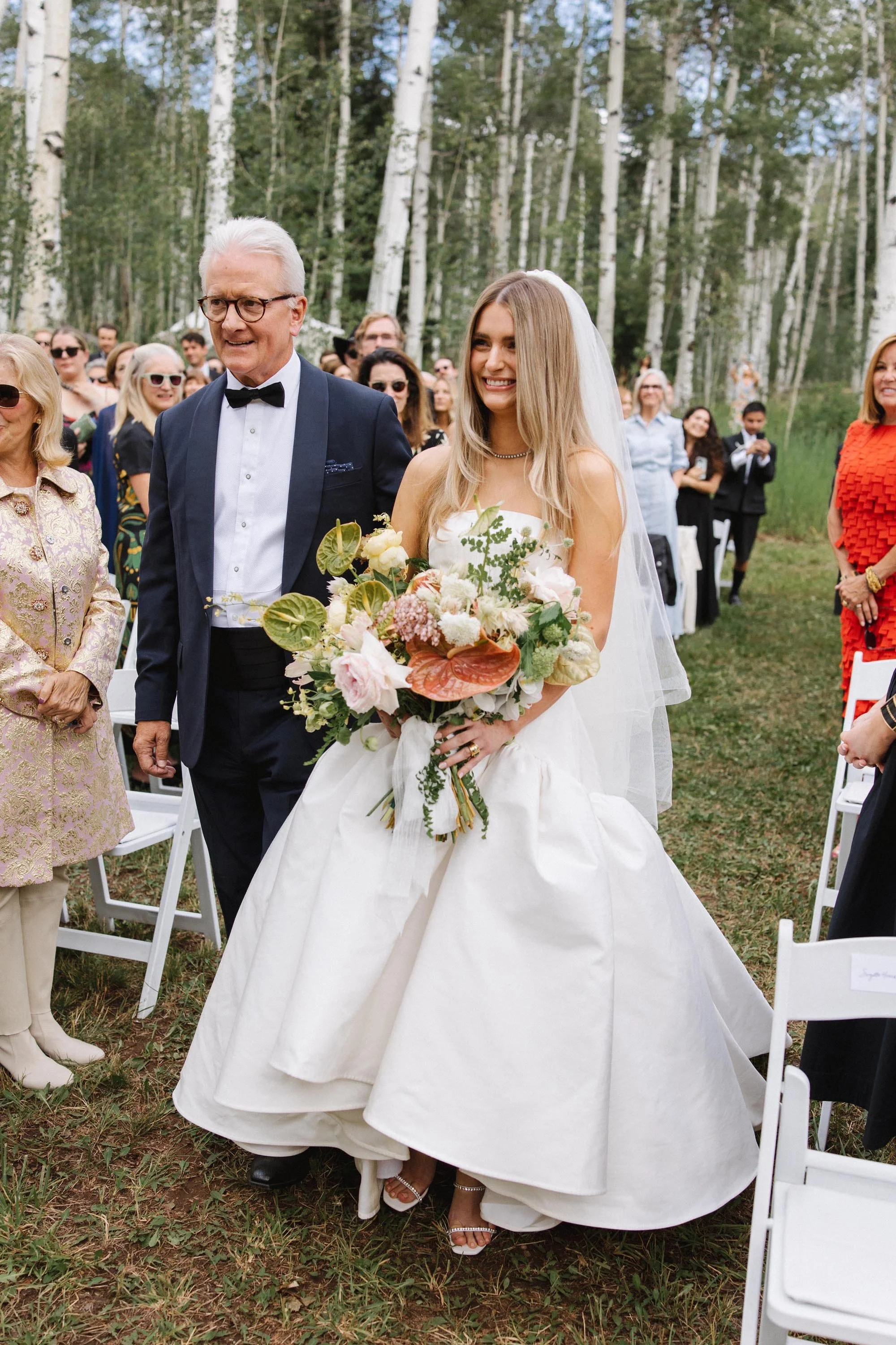 a beautiful colorado bride and her father reaching the altar at her wedding