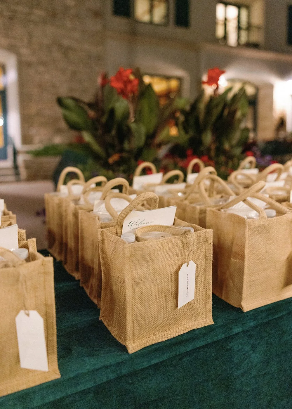 Thoughtfully assembled welcome bags greet guests upon arrival, offering a warm introduction to the wedding weekend. Curated by experienced luxury wedding planners, these personalized gifts create a memorable first impression and elevate the overall