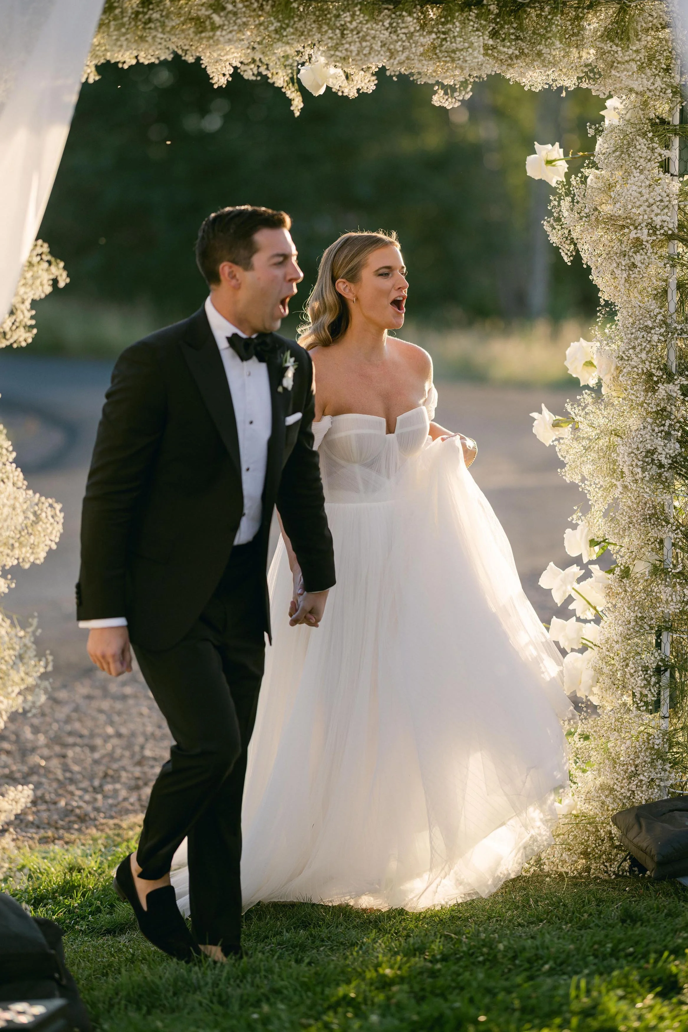 a bride and groom celebrating their new marriage at the altar