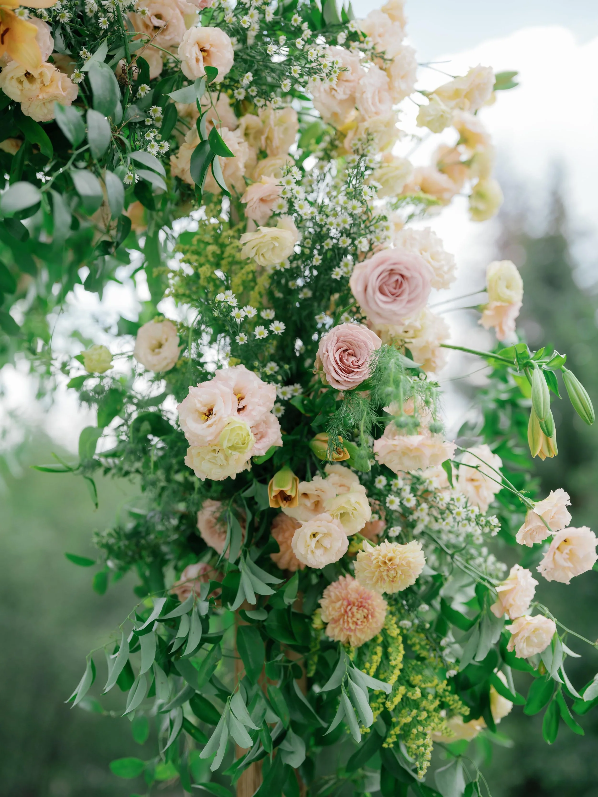 a beautiful luxurious floral arrangement on the wedding altar