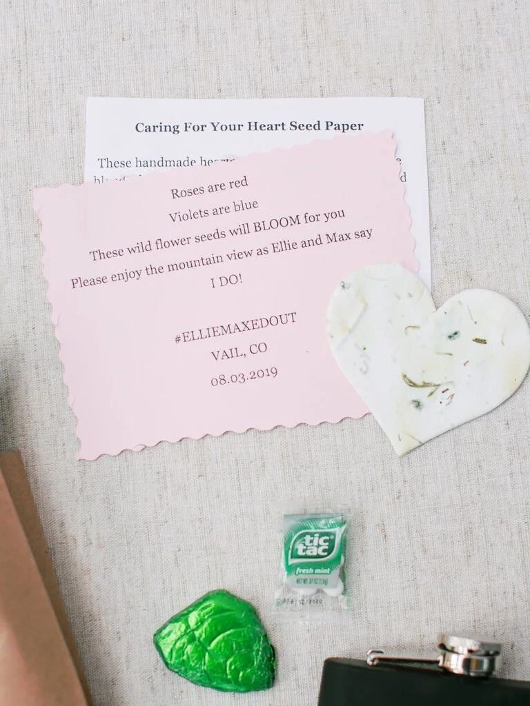 Pink wedding favor card with poem and heart-shaped seed paper for guests to plant wildflowers.