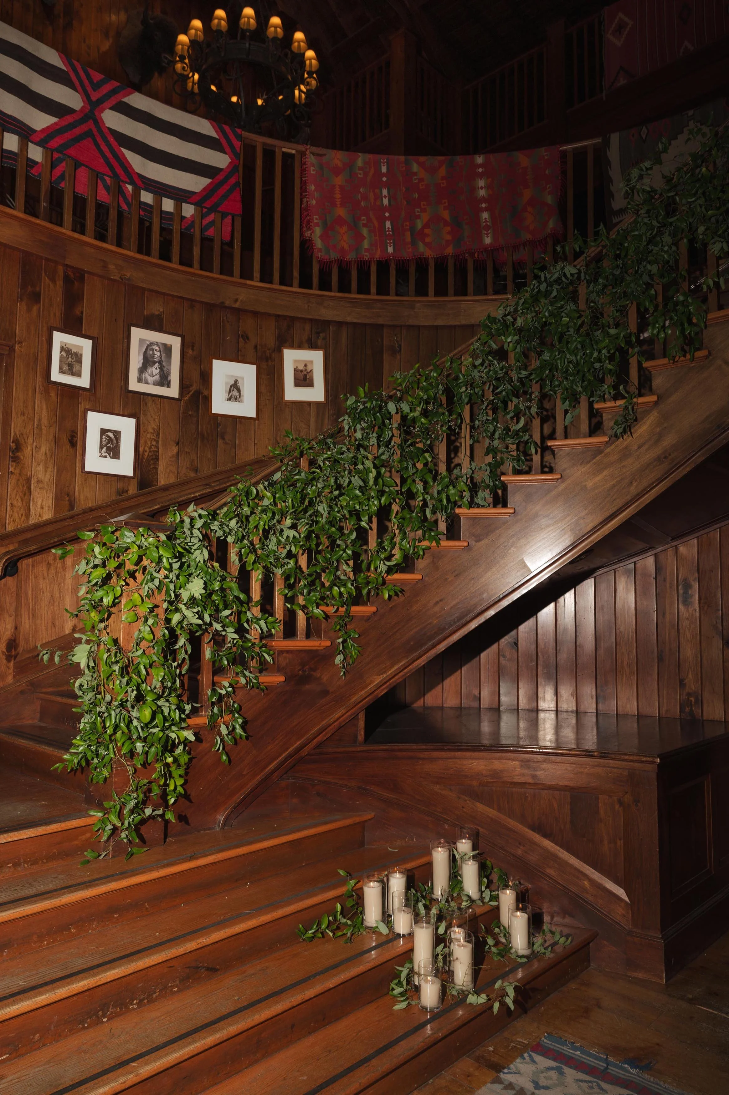 a leafy decorated grand staircase at a private venue in beaver creek colorado