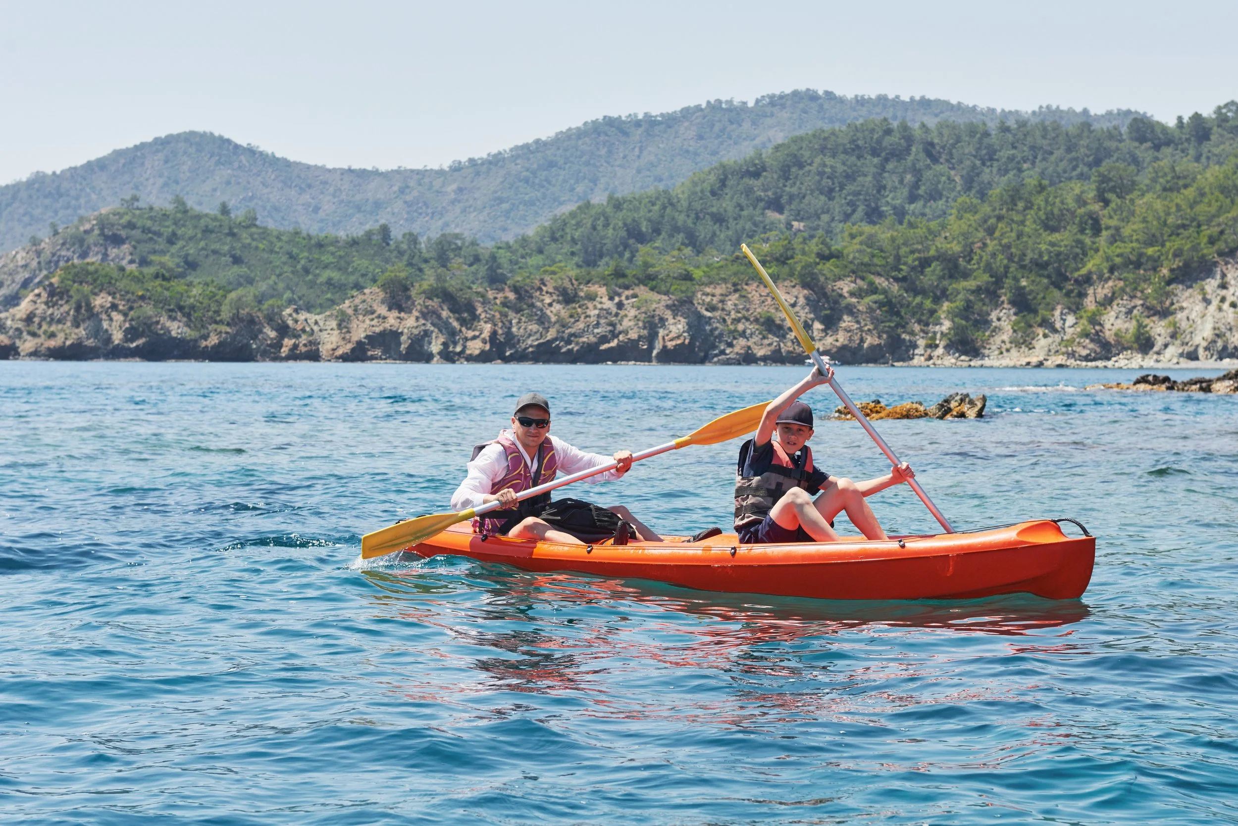 boat-kayaking-near-cliffs-sunny-day-kayaking-quiet-bay-amazing-views-travel-sports-concept-lifestyle-happy-family.jpg