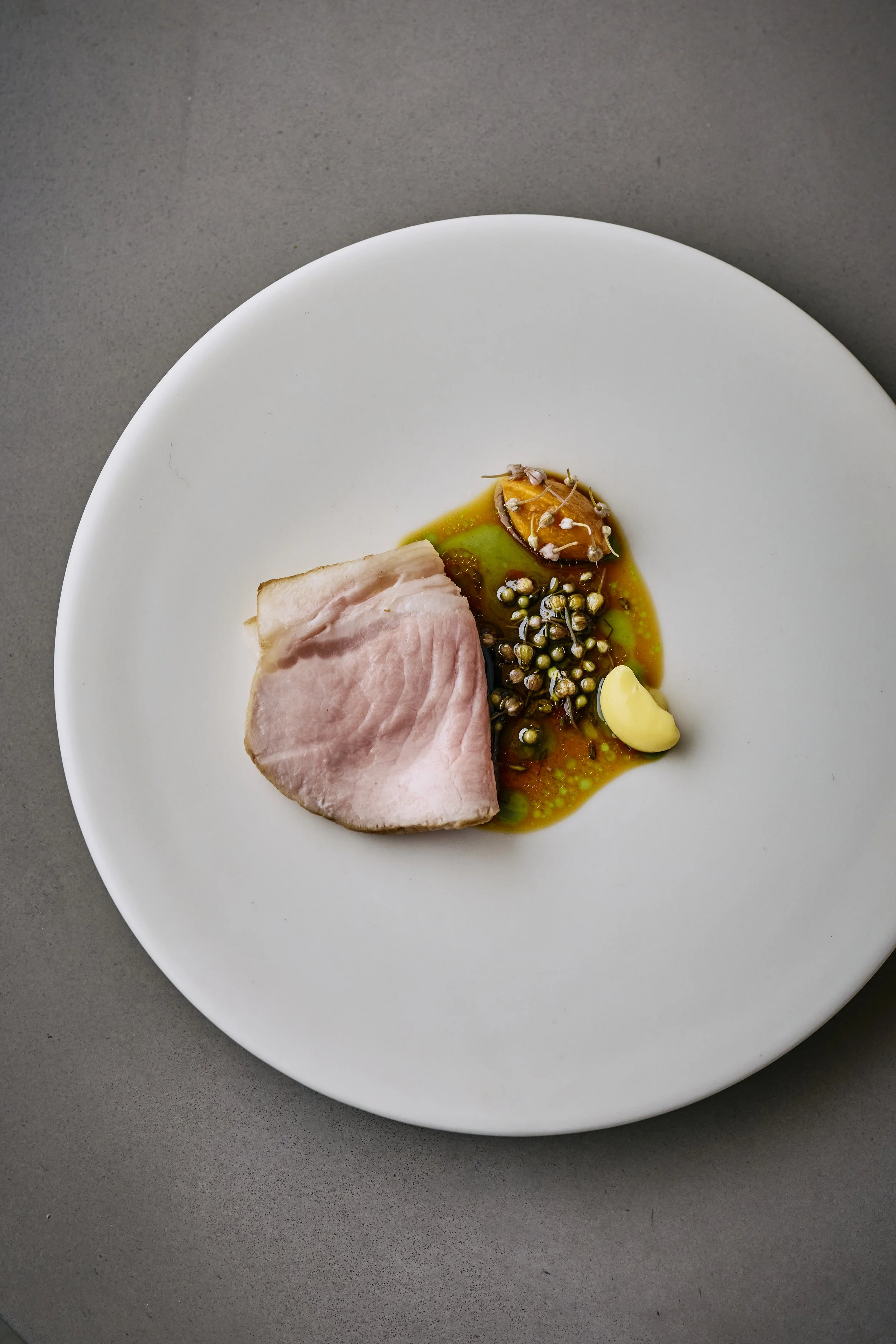 35 Day aged Californian Berkshire from Samuel, with preserved seeds, grilled lactic apricots and smoked and aged pork fat.