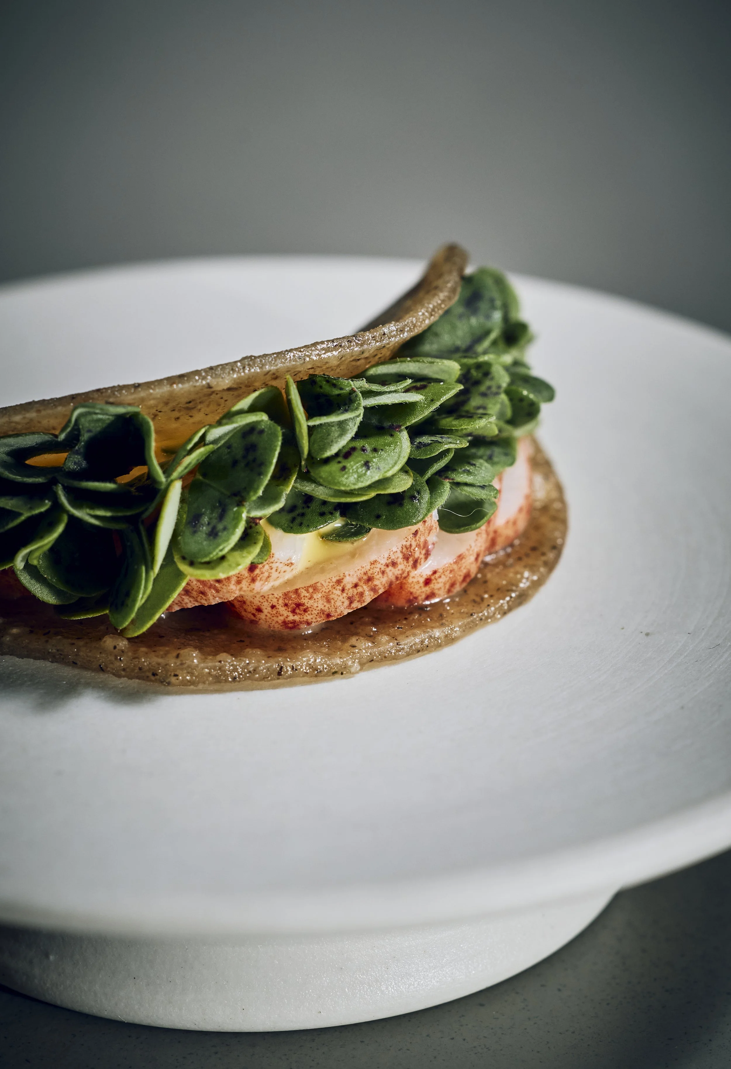 House-milled Rye Tunnbröd with lobster claws cooked in beer and a brown butter cream seasoned with pickled dill seeds.