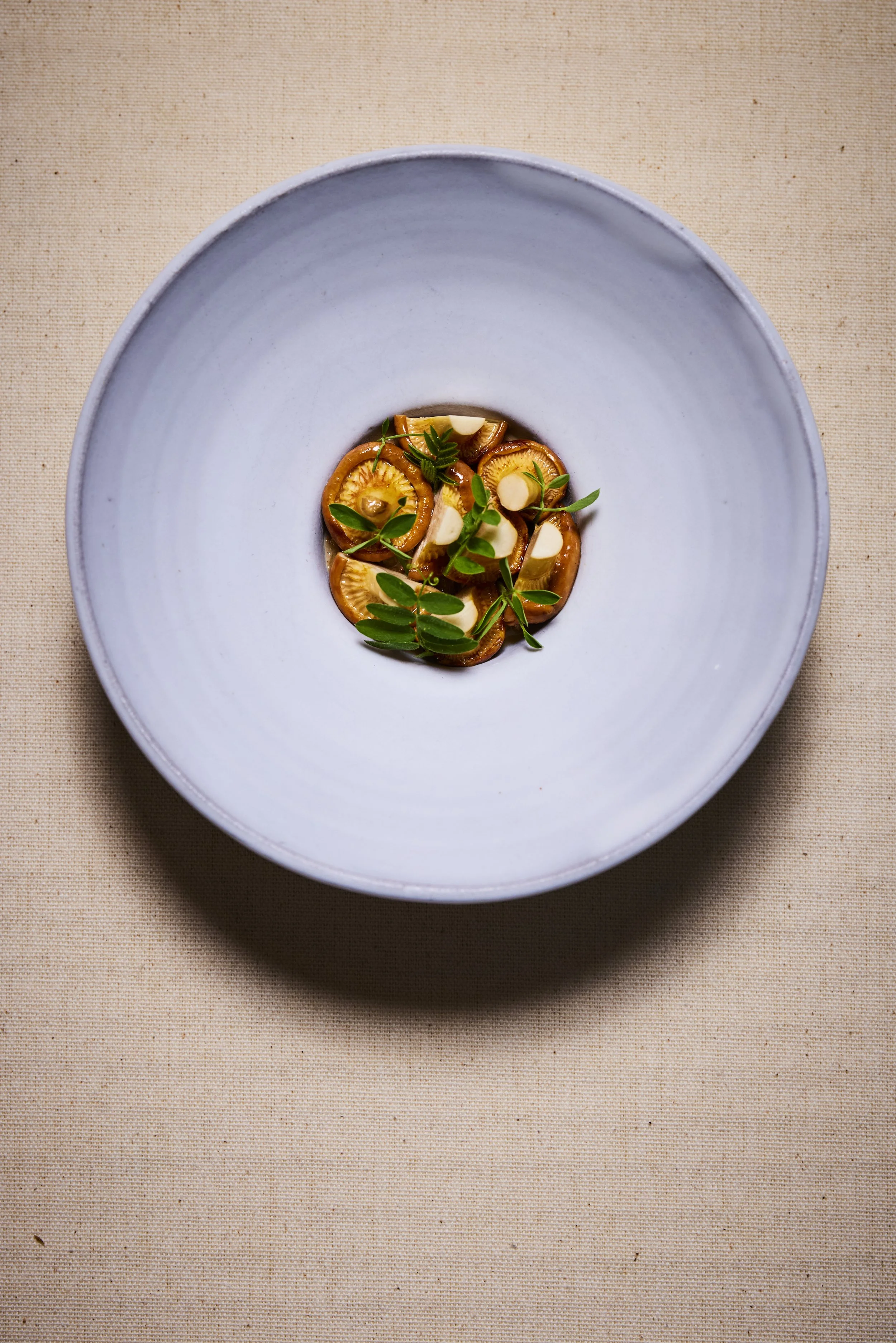 Toasted and sprouted buckwheat with chanterelles and wild pea shoots.