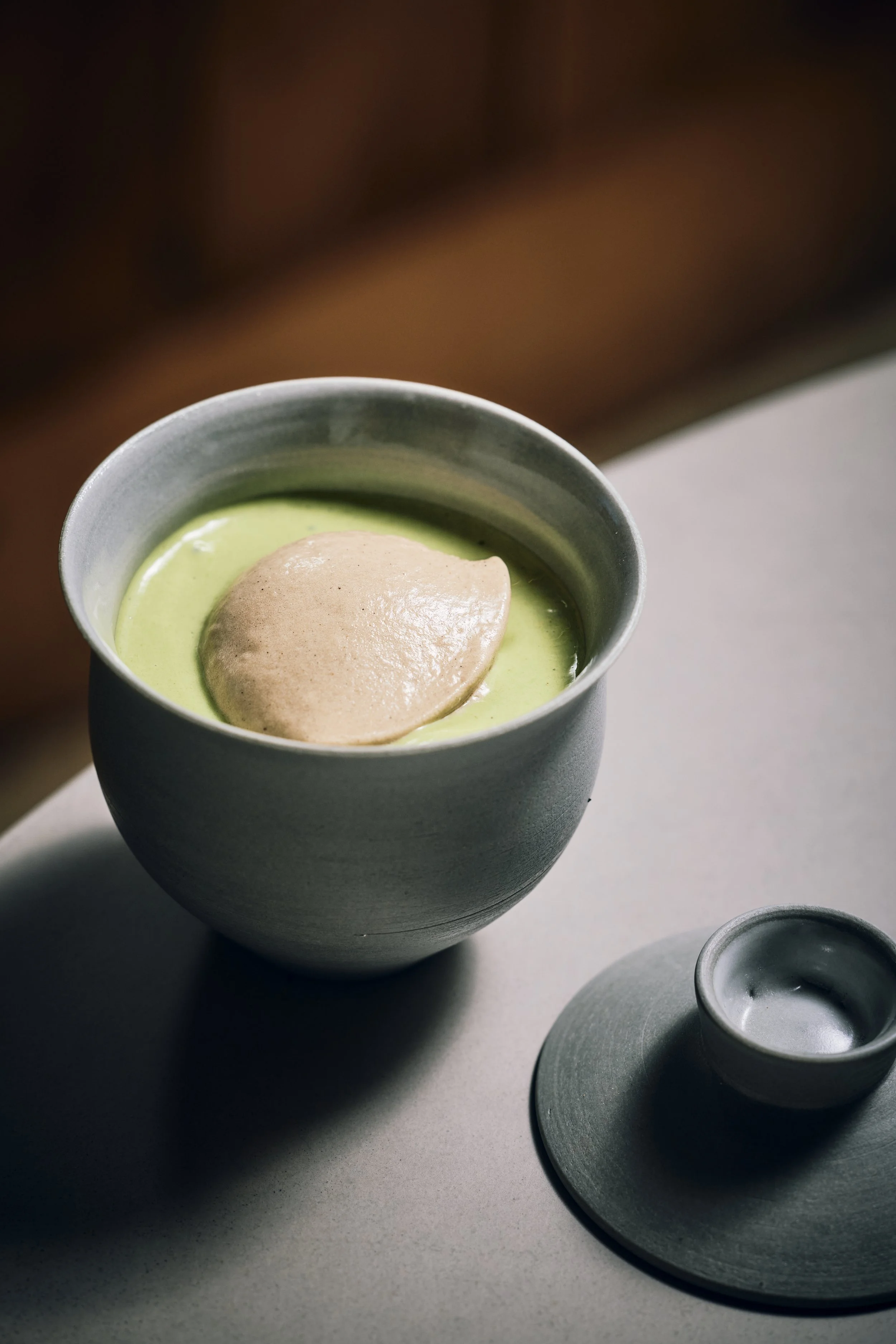 Grilled apple ice cream with acorn cake, reduced apple juice and spruce cream.
