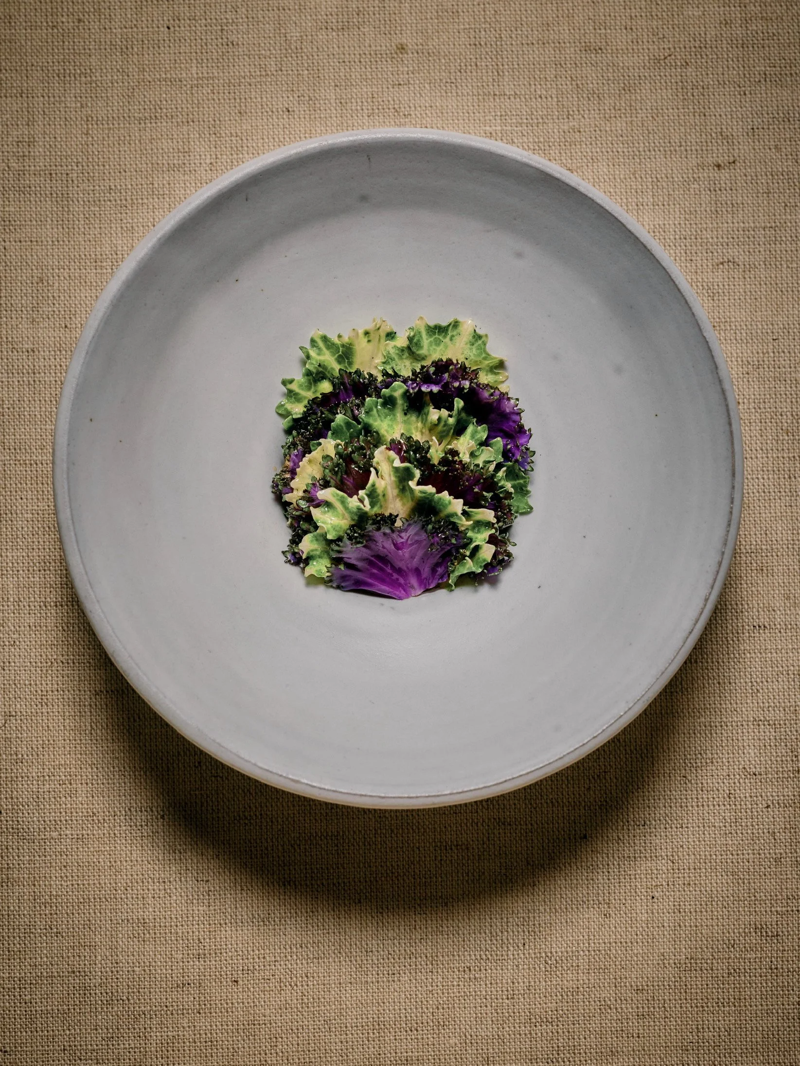 Toasted and Sprouted buckwheat with lightly grilled variegated kale and slowly cooked ramp bulbs.