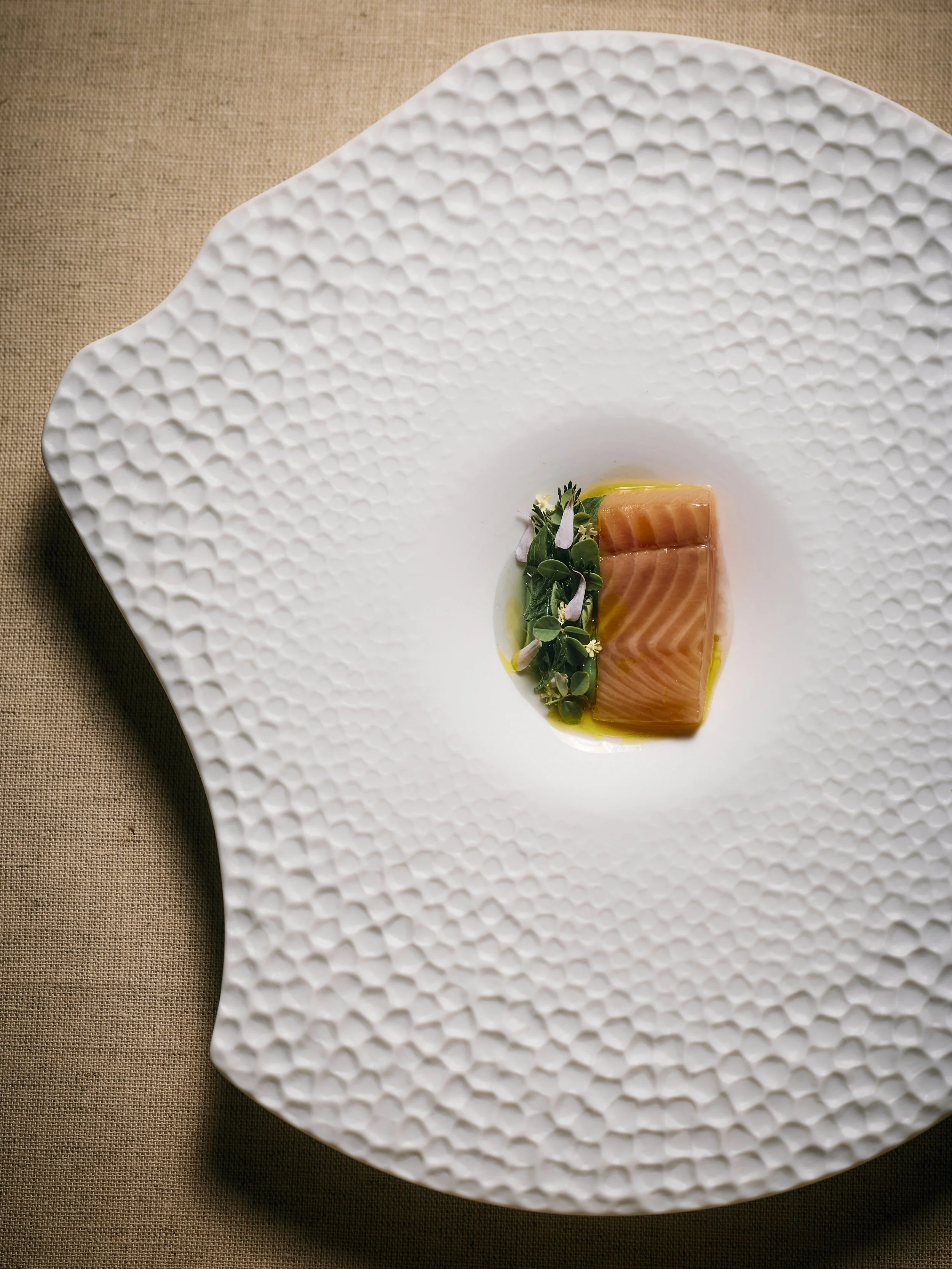 Lightly poached trout brushed with a syrup made from pinecones and green asparagus.