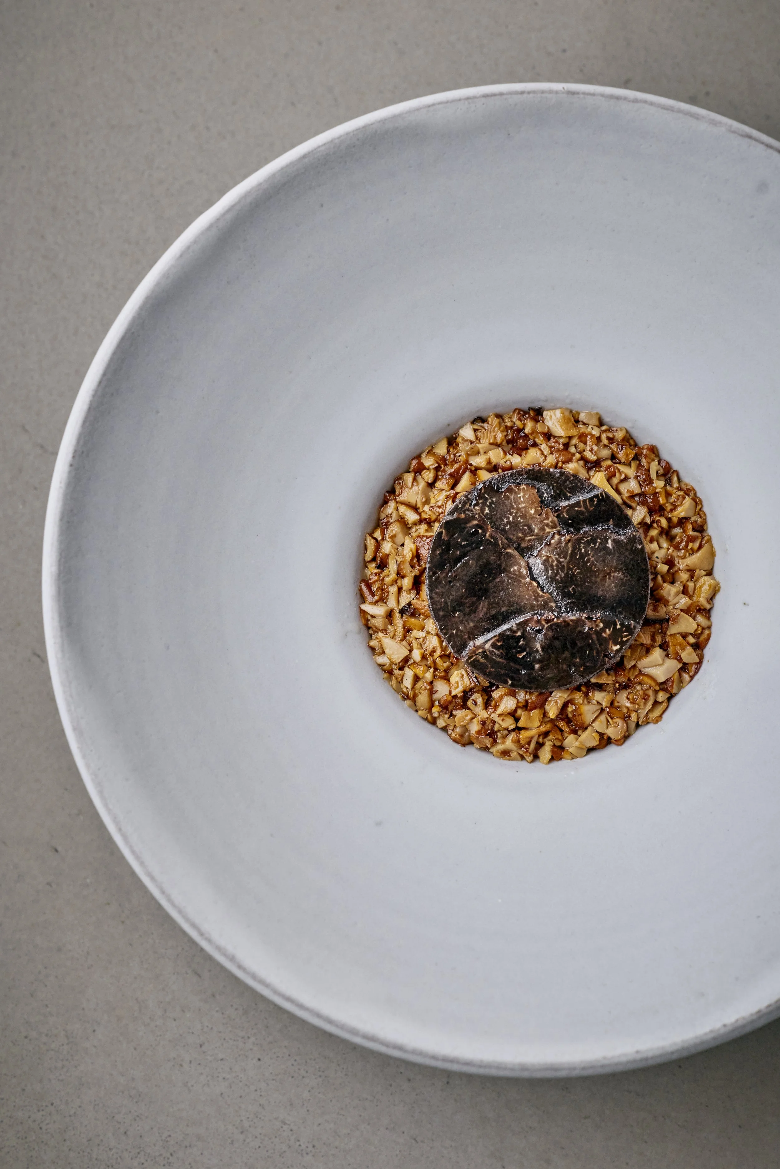 Toasted and sprouted buckwheat with chanterelles and winter truffles.