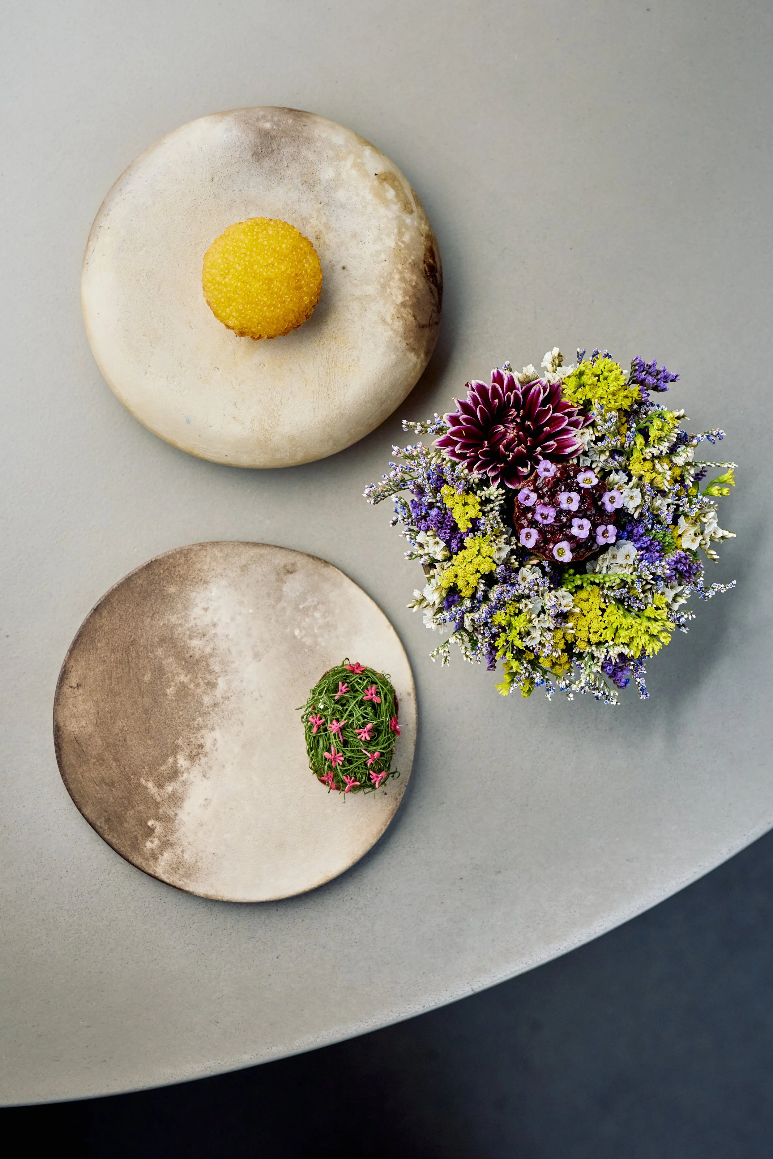 Clockwise from the top: Smoked whitefish roe with pork fat, aged Raya and salted leeks, 42 day dry aged dairy cow with grilled butter and elderberries, cured lamb heart with horseradish, homemade creme fraiche and sorrel.
